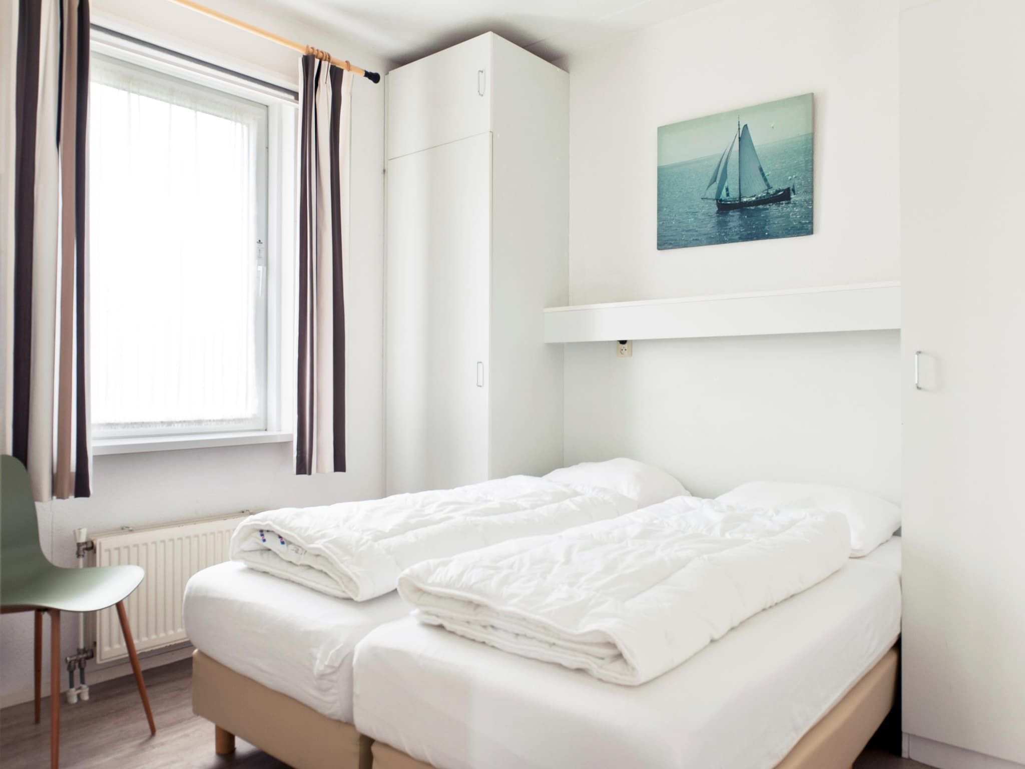 Een slaapkamer van Wiid Wellness de luxe met sauna & buitenspa in Friesland