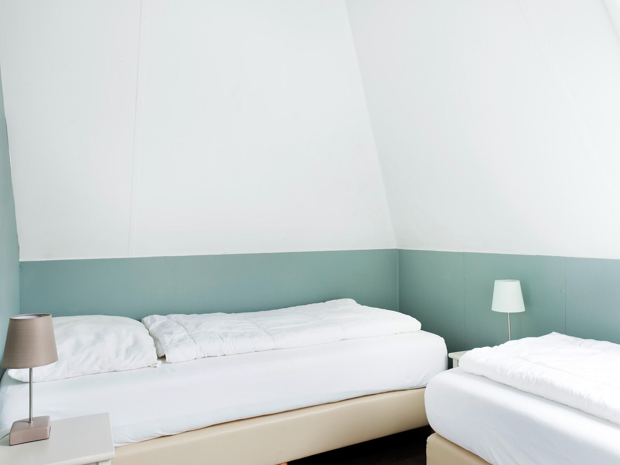 Een slaapkamer van Wiid Wellness de luxe met sauna & buitenspa in Friesland