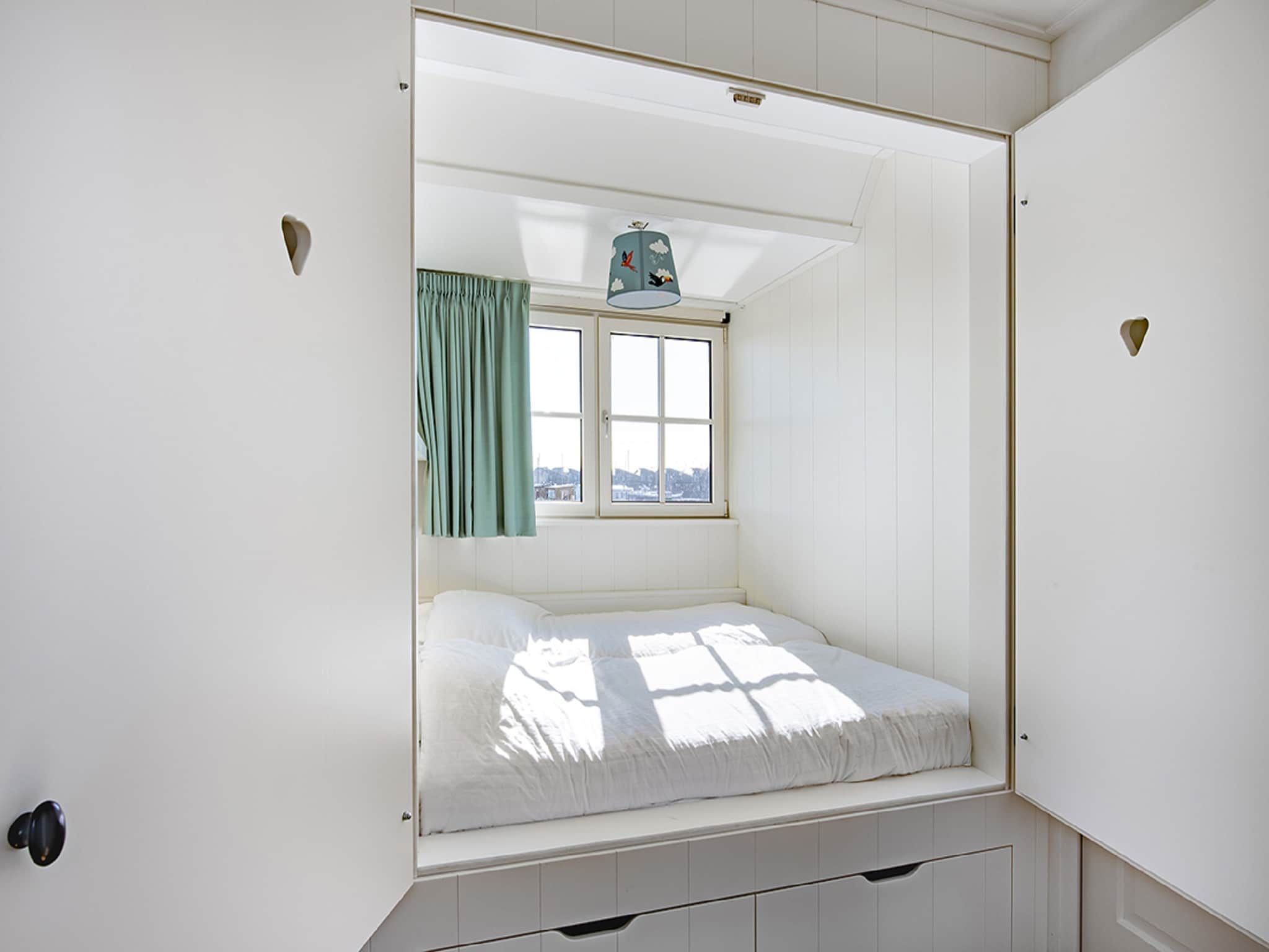 Een slaapkamer van Friese Meren Villa's 22 in Delfstrahuizen