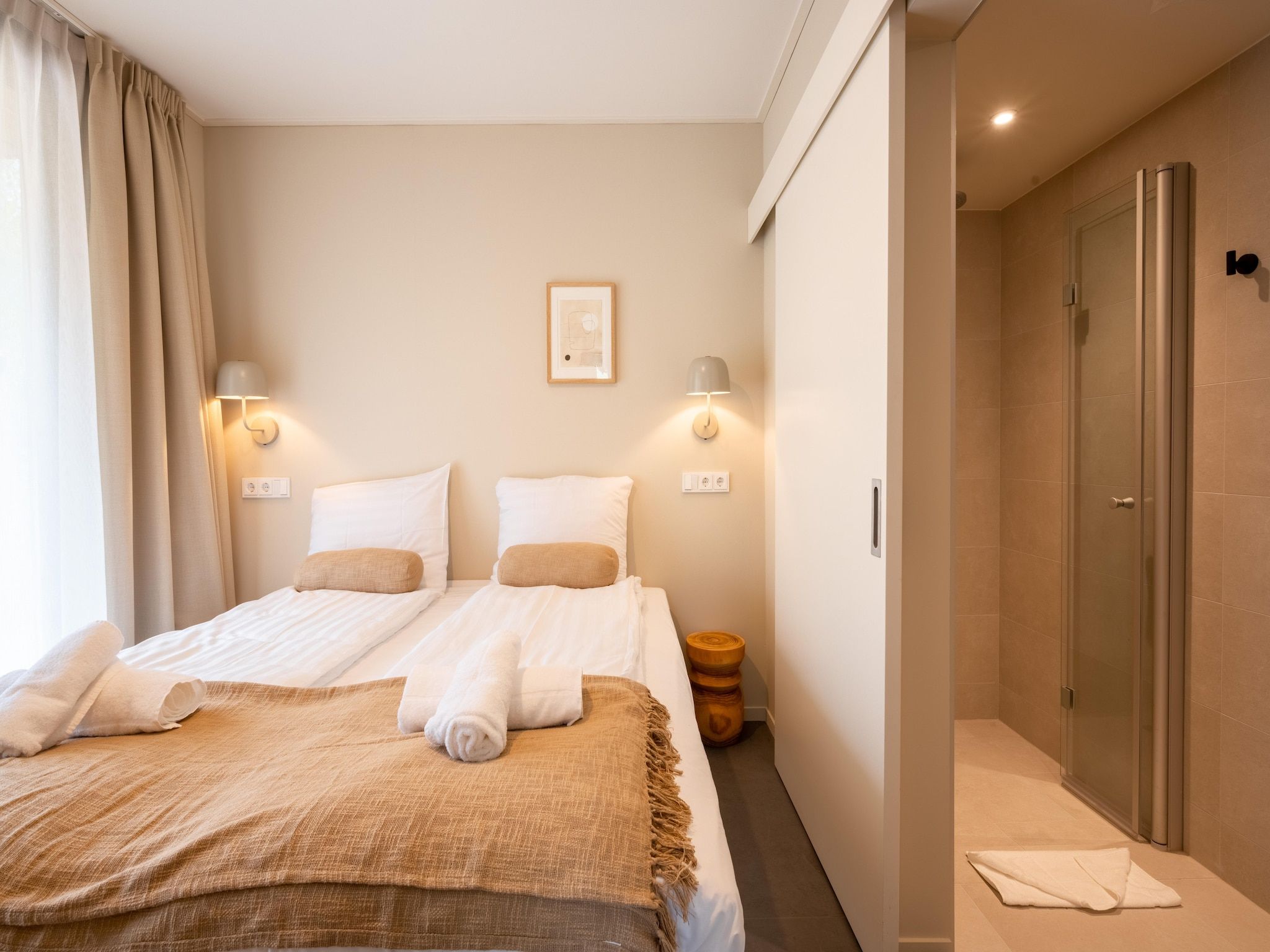 Een slaapkamer van Resort de Parel 11 in Zeewolde