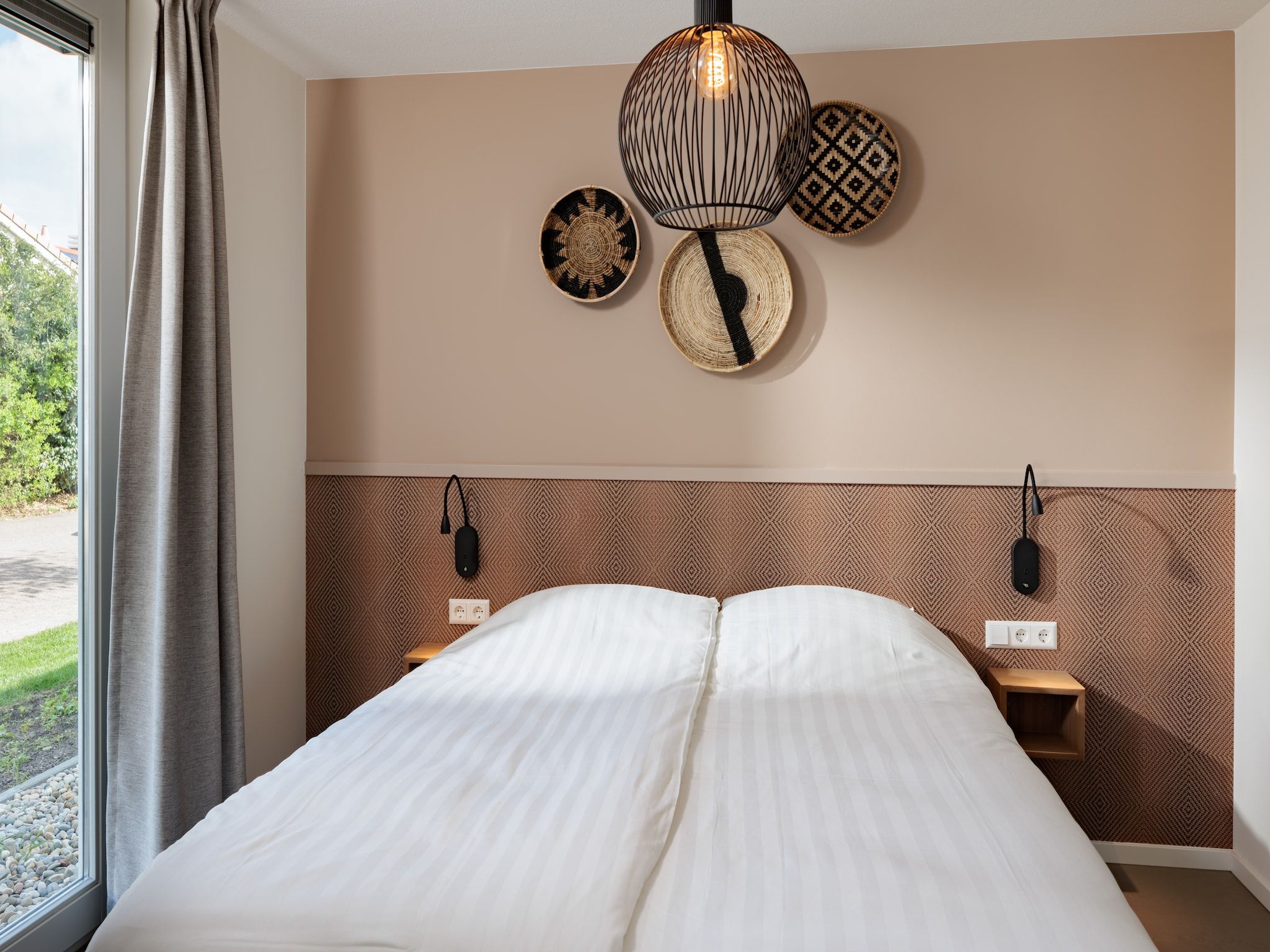 Een slaapkamer van Duinresort Dunimar 5 in Noordwijkerhout