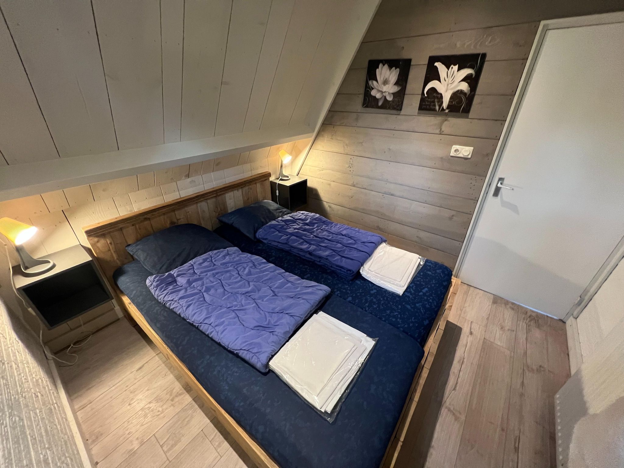 Een slaapkamer van Combi bungalow Vosseven 84 & 85 in Stramproy