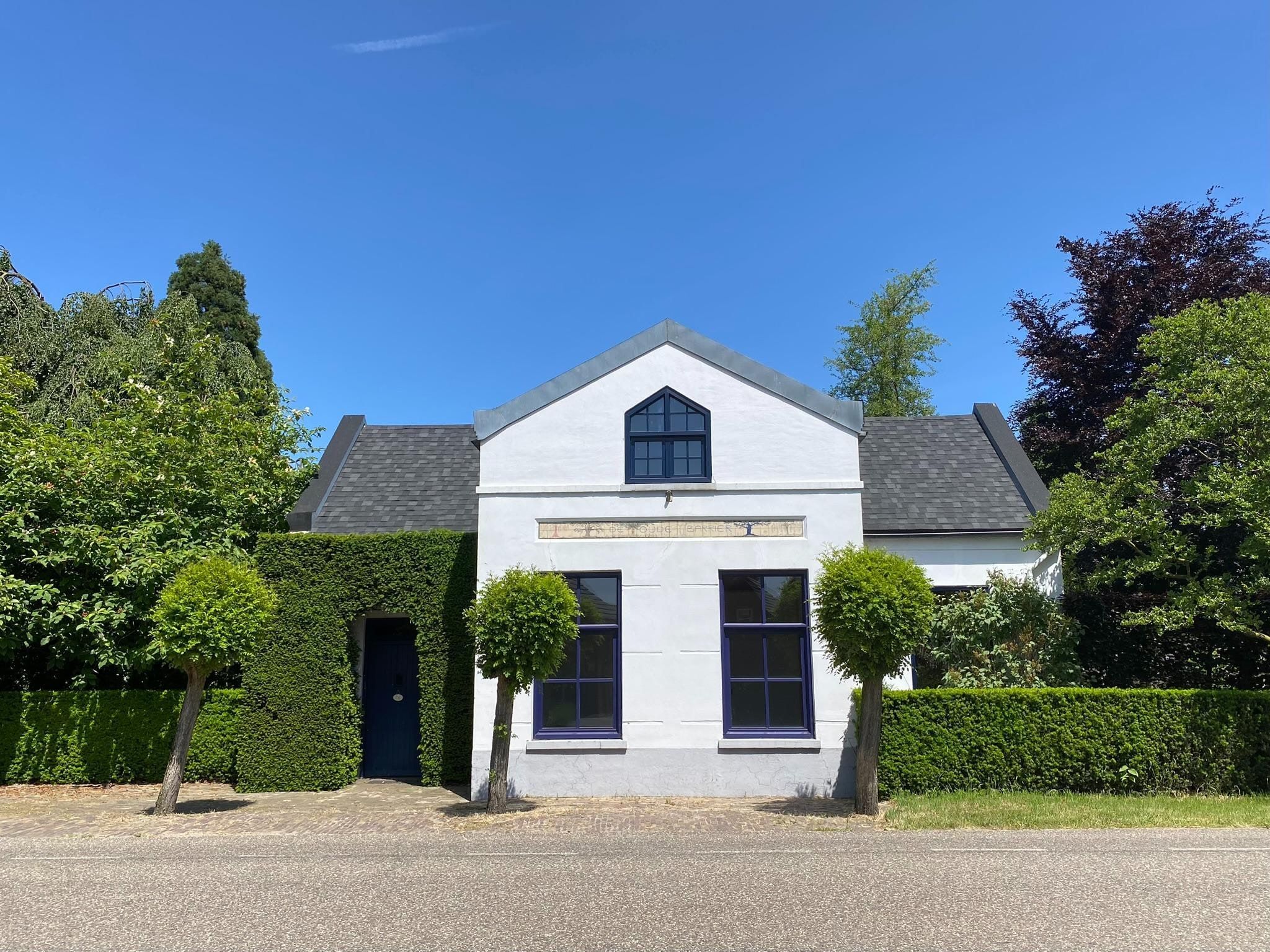 De buitenkant van Dorpswoning Het Tolhuis in Leende