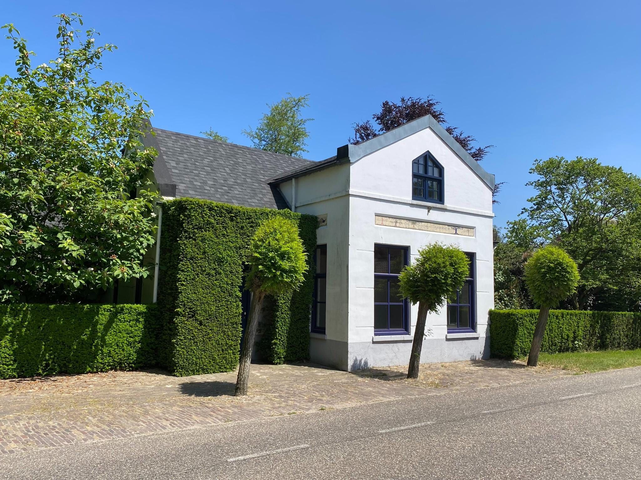 De buitenkant van Dorpswoning Het Tolhuis in Leende