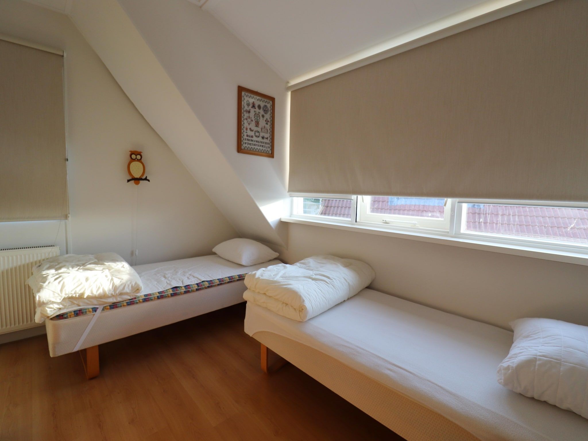 Een slaapkamer van De Wetterkant in Grou