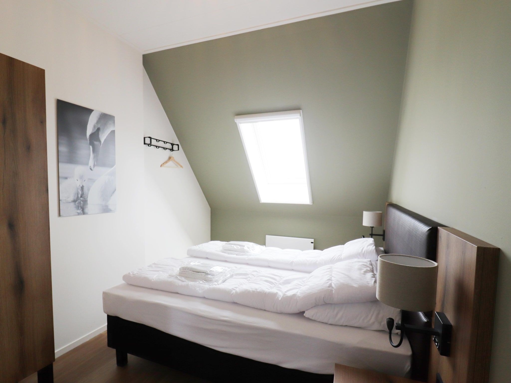 Een slaapkamer van combinatie van 2x 10 persoons woning in Leons