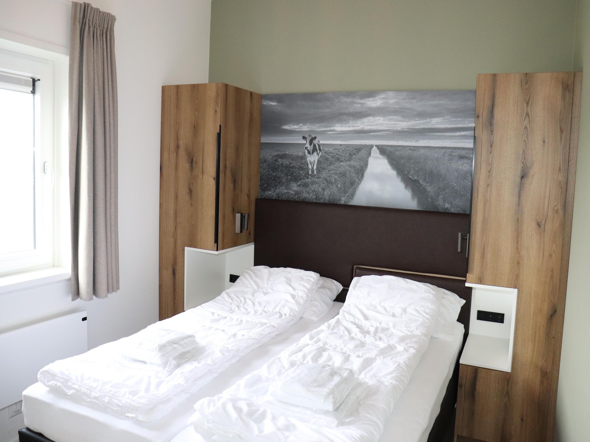 Een slaapkamer van combinatie van 2x 10 persoons woning in Leons