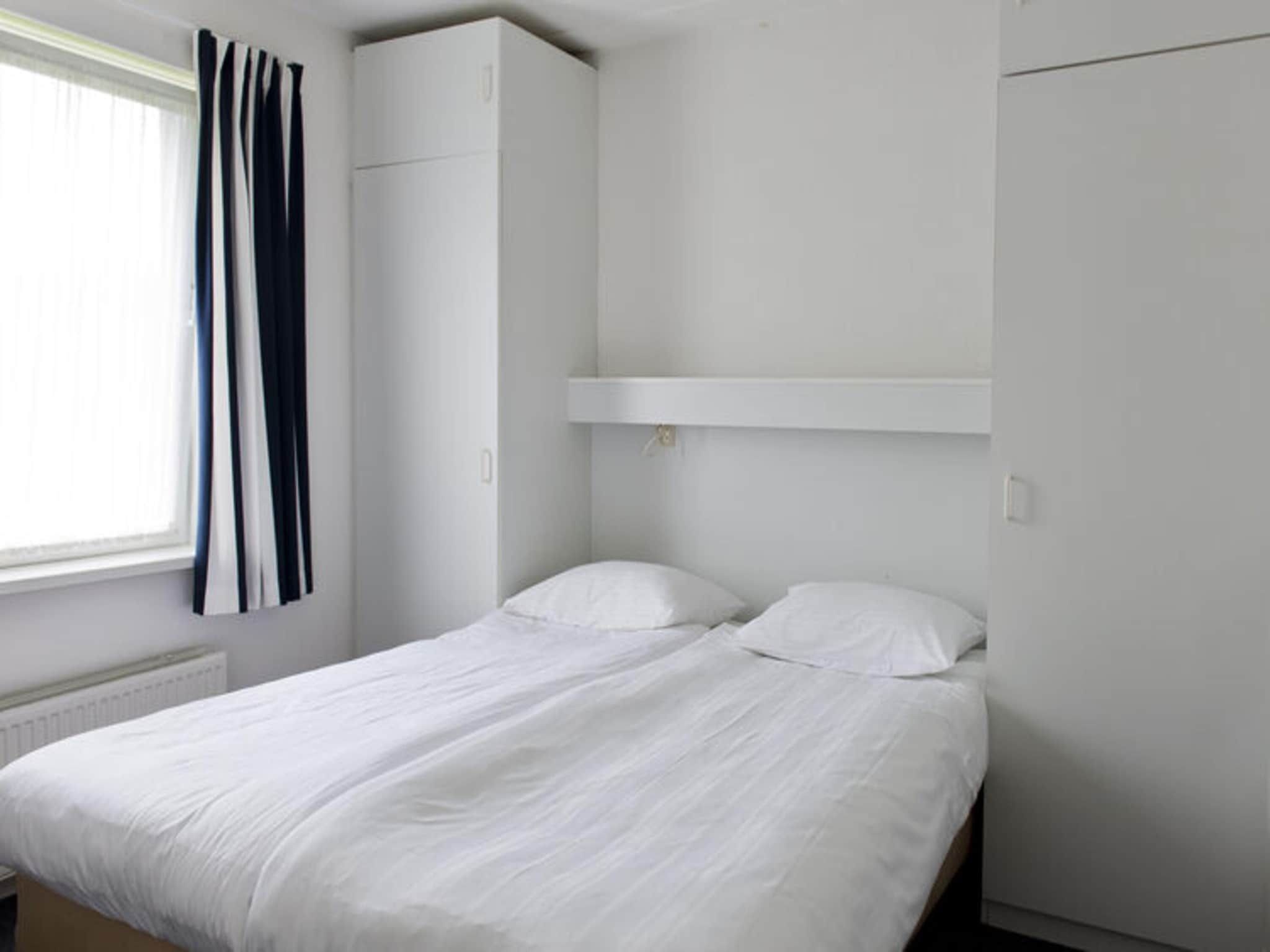 Een slaapkamer van Grand Tolve Wellness de luxe met sauna buitenspa & sloep in Earnewald