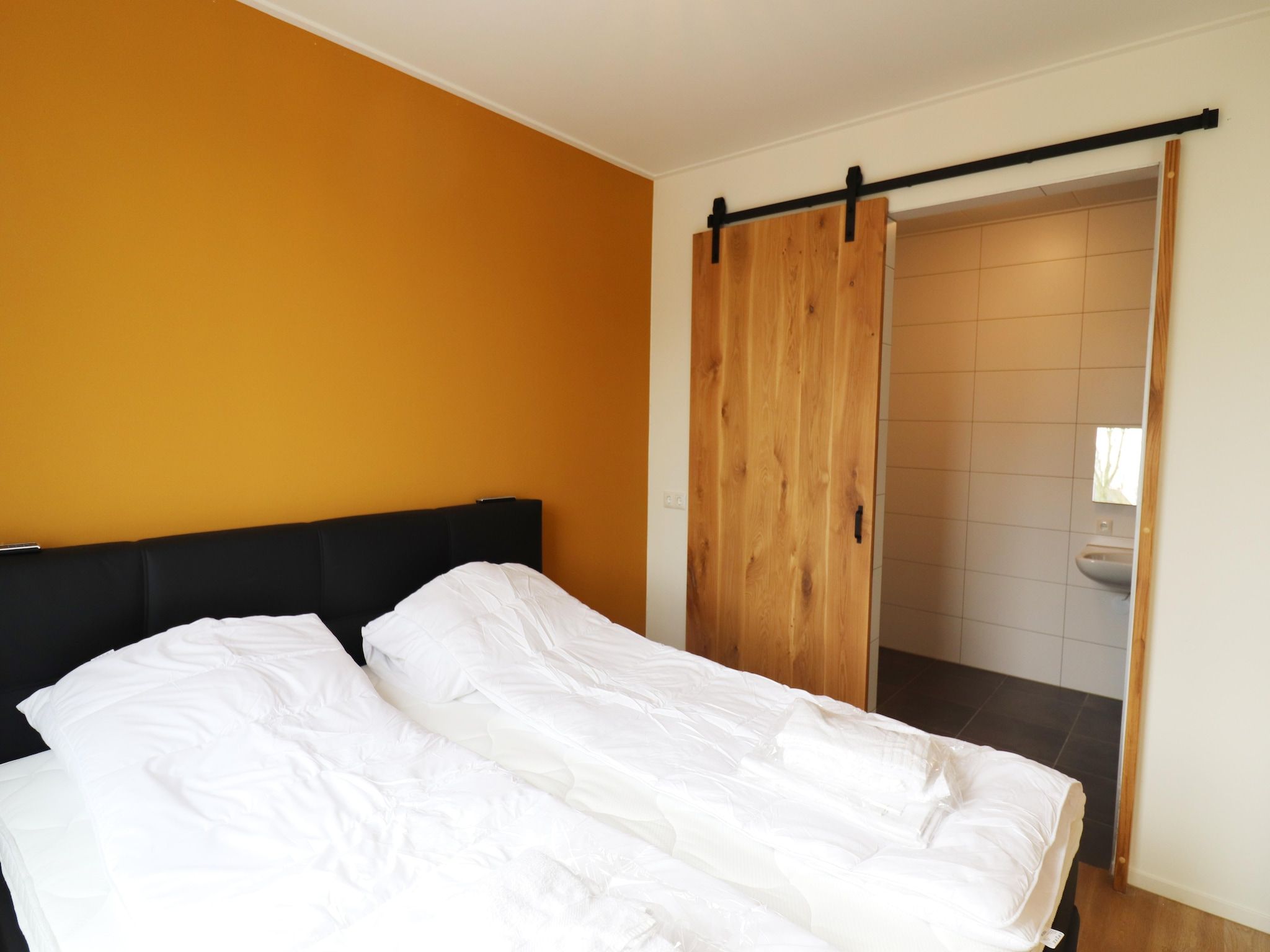 Een slaapkamer van Friese villa in Leons in Leons