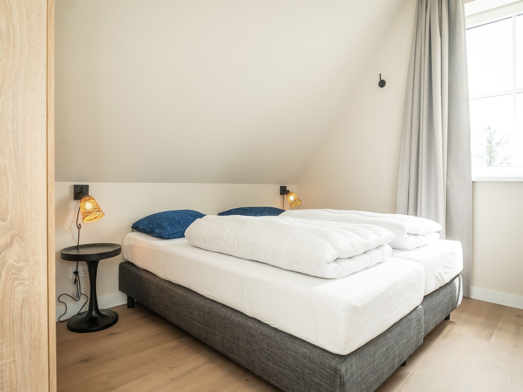 Een slaapkamer van So What 25a in De Koog