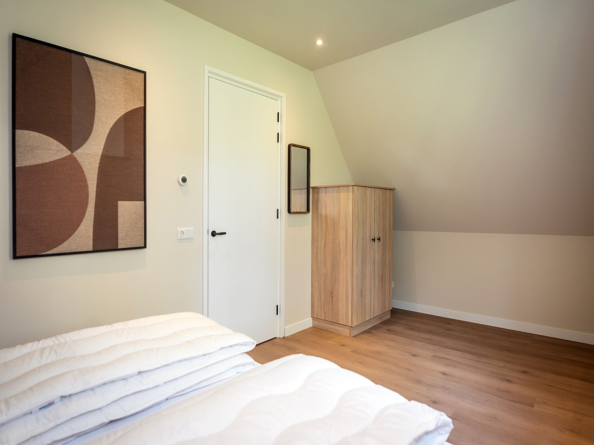 Een slaapkamer van So What 25a in De Koog