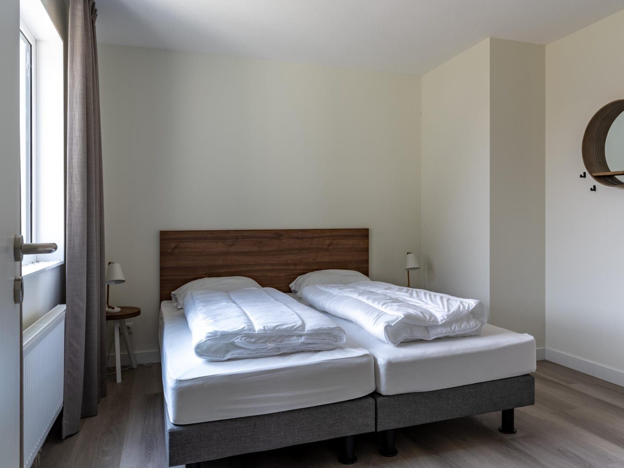 Een slaapkamer van Appartement - Paviljoenwei 4  Sneek Offingawier 'Havenzicht' in Sneek