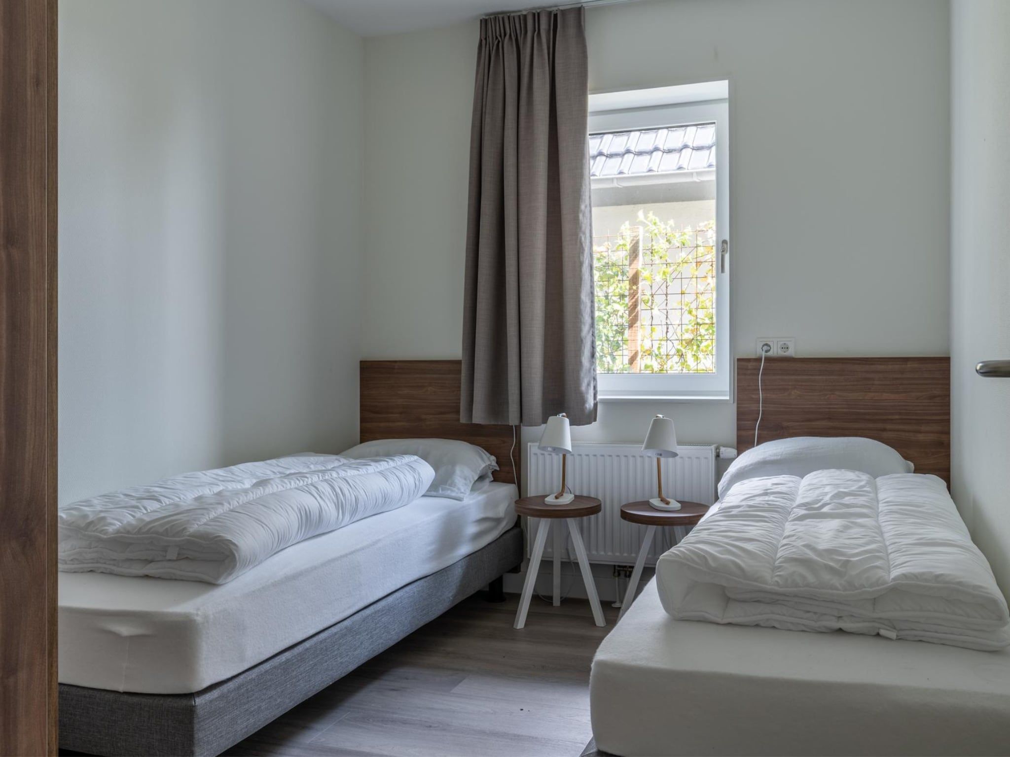 Een slaapkamer van Appartement - Paviljoenwei 4  Sneek Offingawier 'Havenzicht' in Sneek