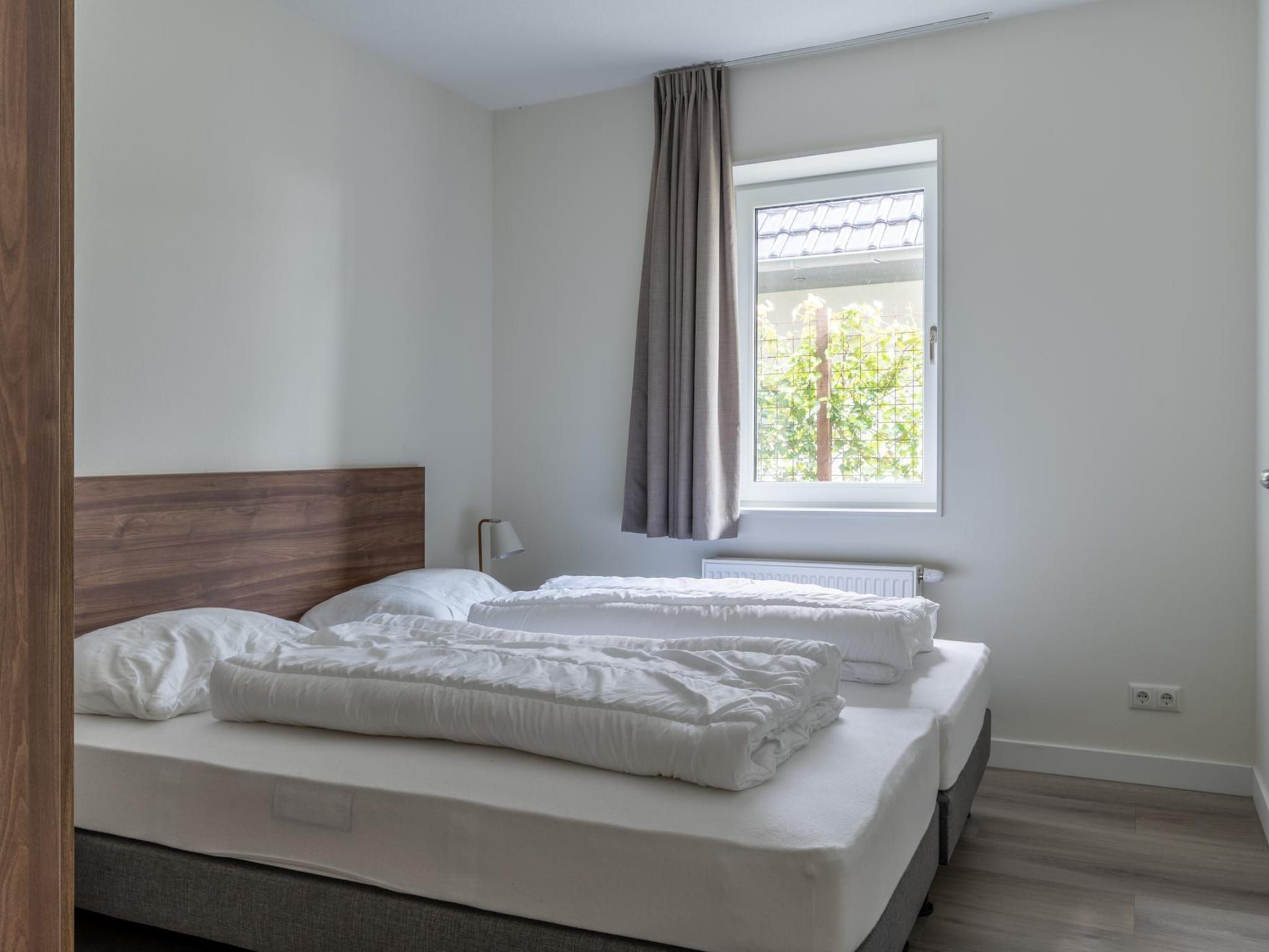 Een slaapkamer van Appartement - Paviljoenwei 4  Sneek Offingawier 'Havenzicht' in Sneek