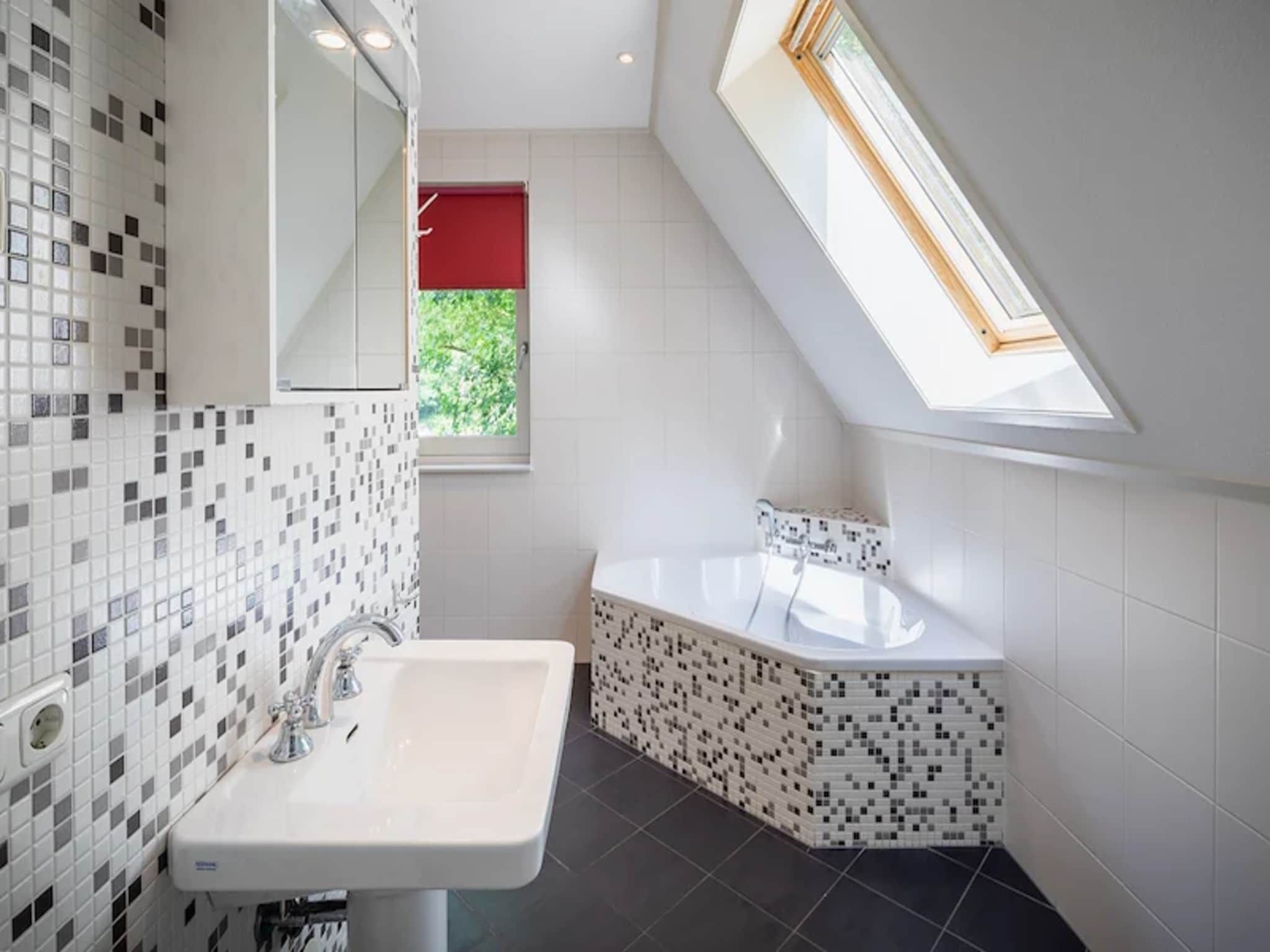 De badkamer van Vakantiepark de Berkenhorst 15 in Kootwijk