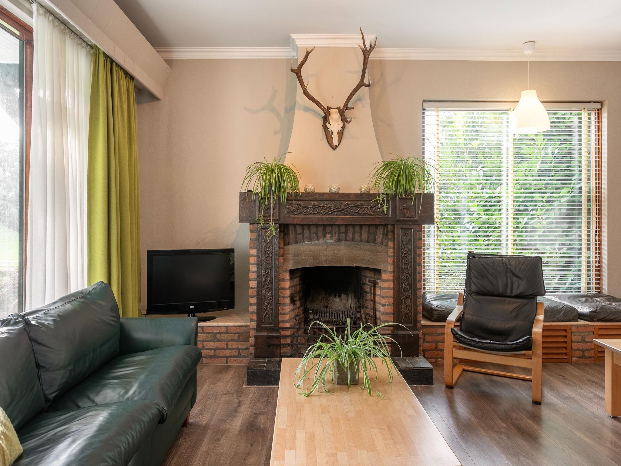 De woonkamer van Vakantiepark Herperduin 21 in Herpen