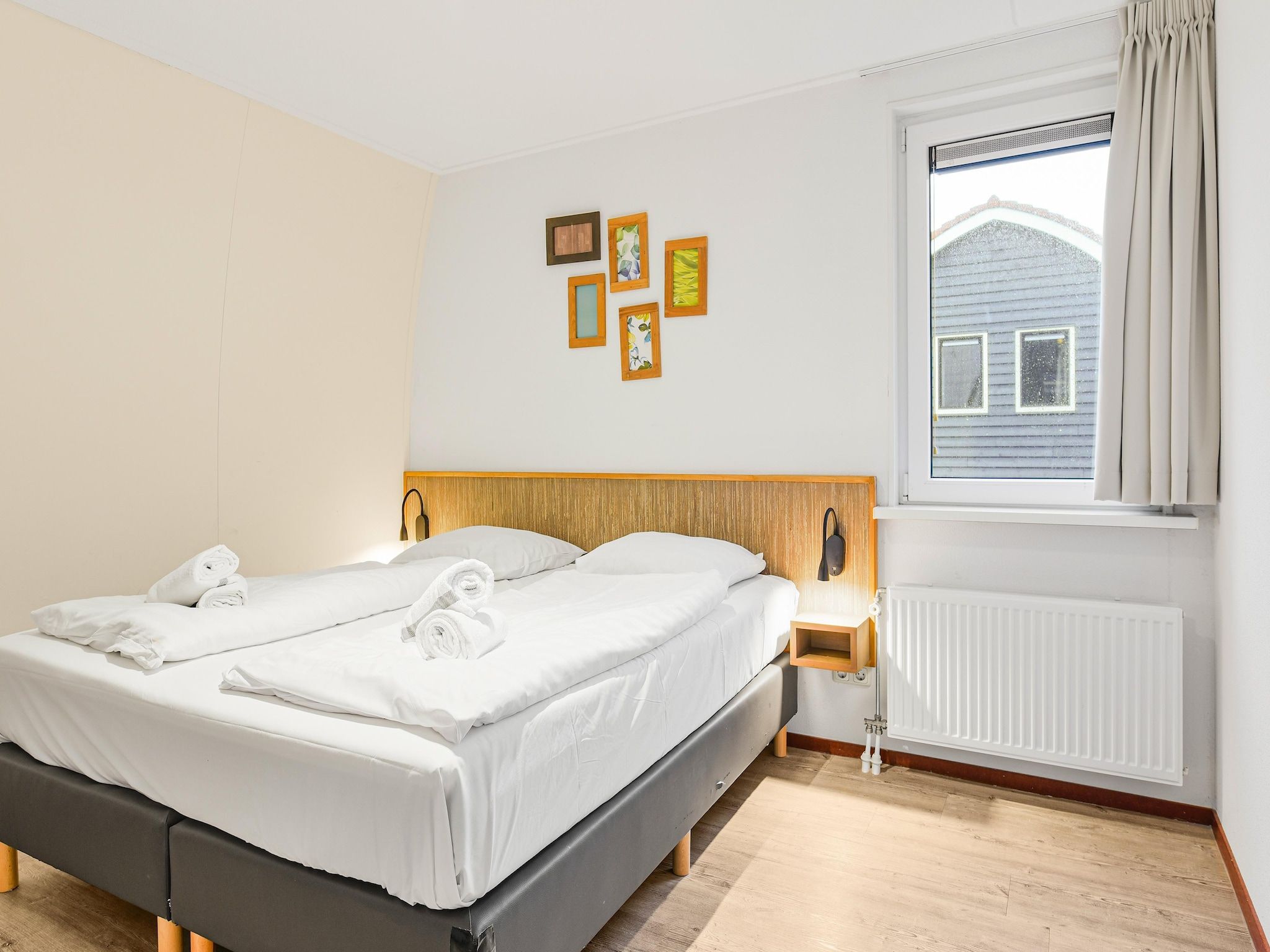 Een slaapkamer van Waterpark De Bloemert 1 in Midlaren