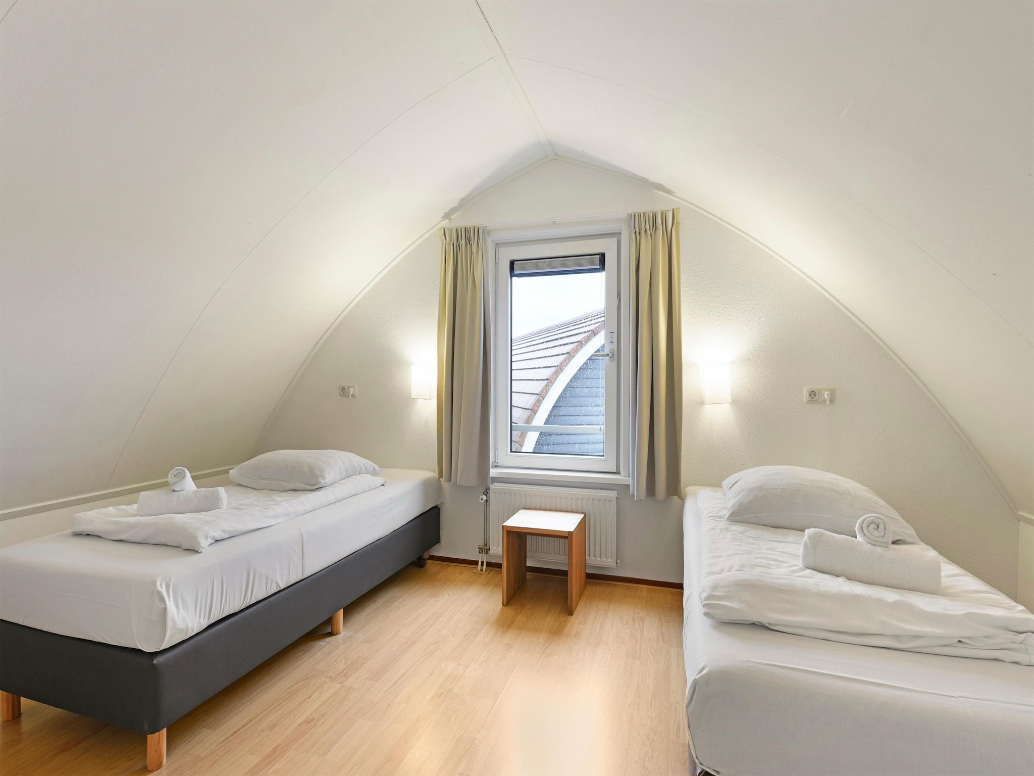 Een slaapkamer van Waterpark De Bloemert 5 in Midlaren