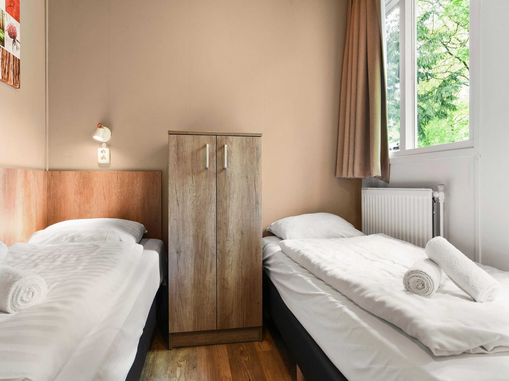 Een slaapkamer van Parc Heihaas 15 in Putten