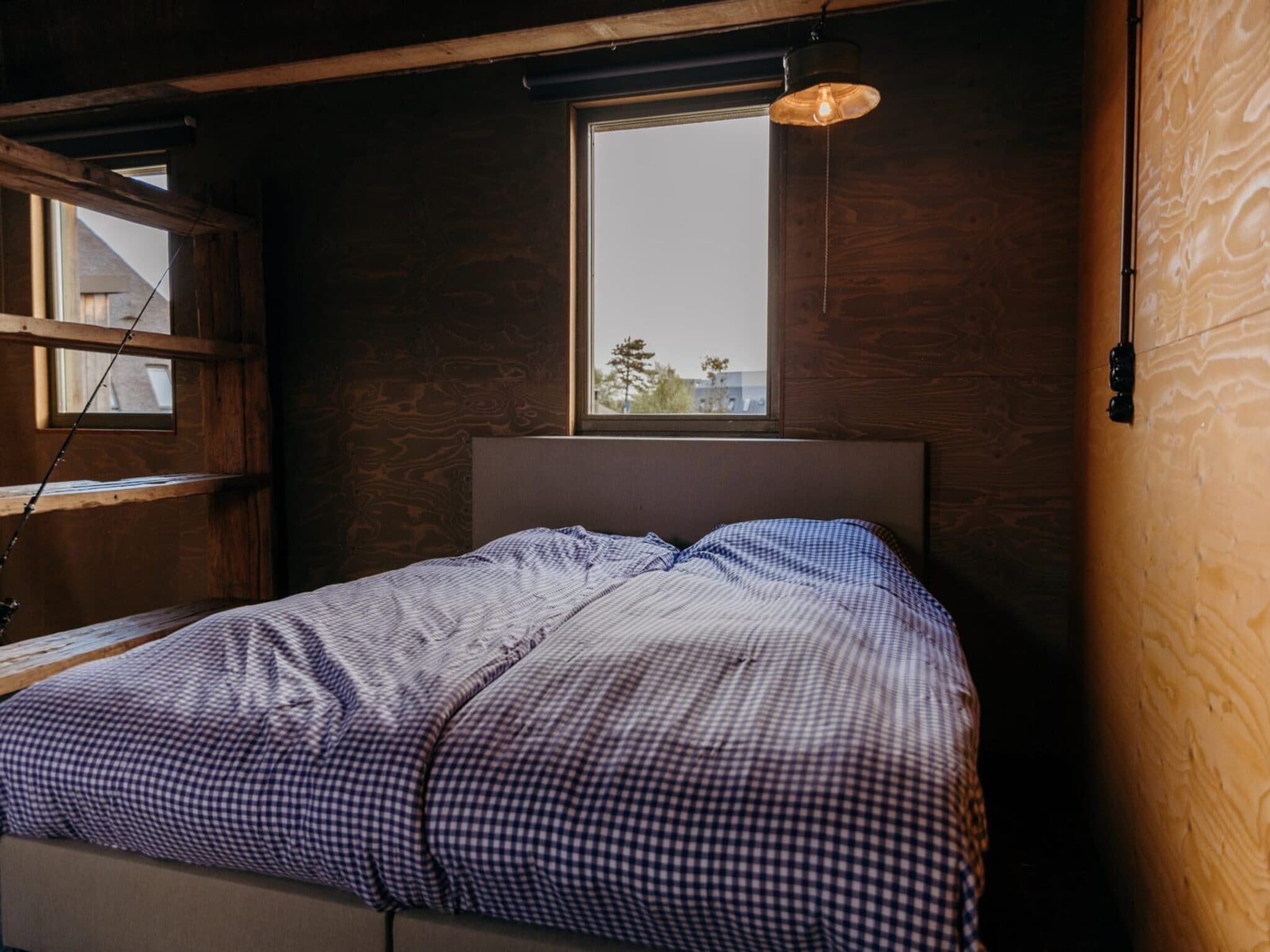 Een slaapkamer van Juttershut Duynpark - Callantsoog in Callantsoog