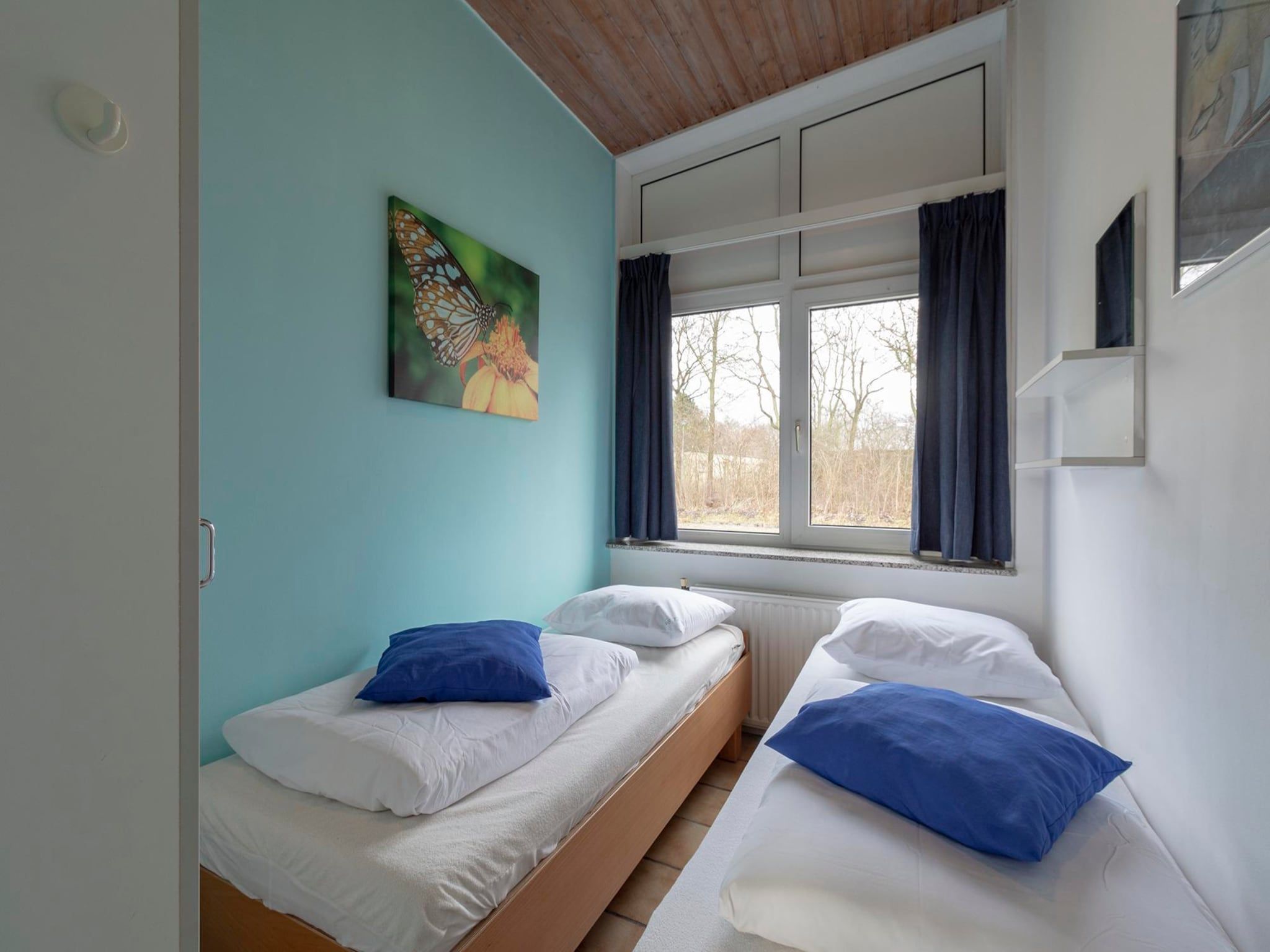 Een slaapkamer van Duinland XL in Sint Maartenszee