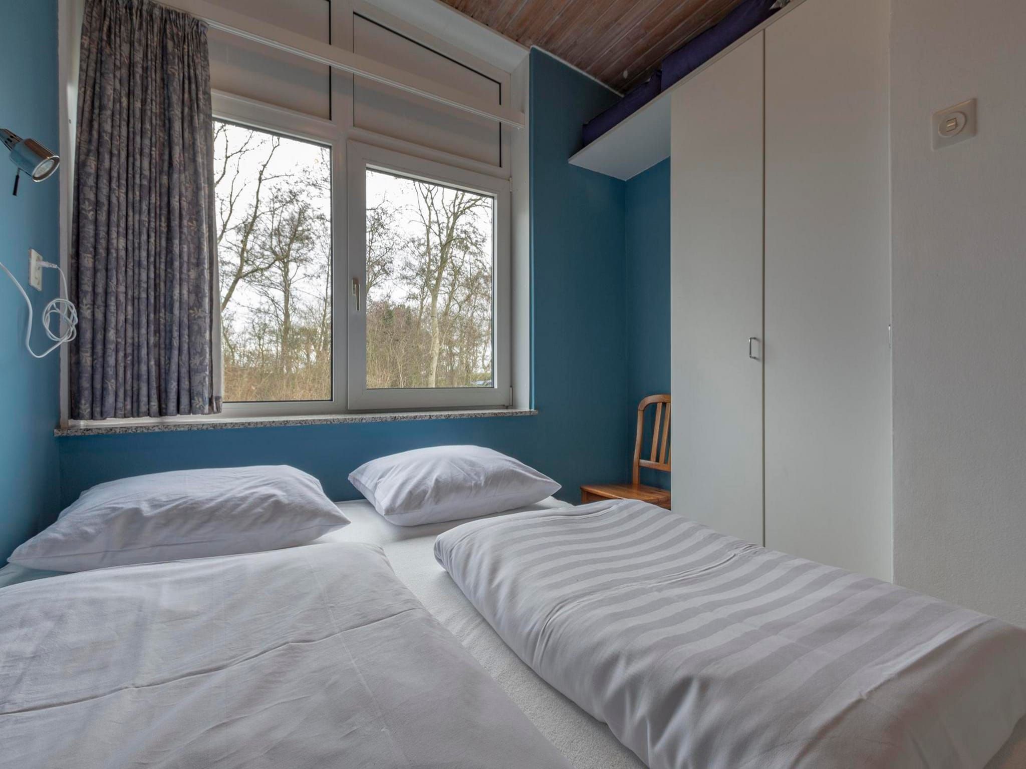 Een slaapkamer van Duinland XL in Sint Maartenszee