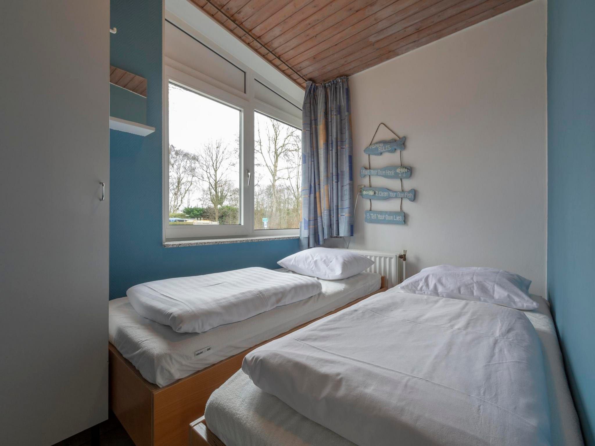 Een slaapkamer van Duinland XL in Sint Maartenszee