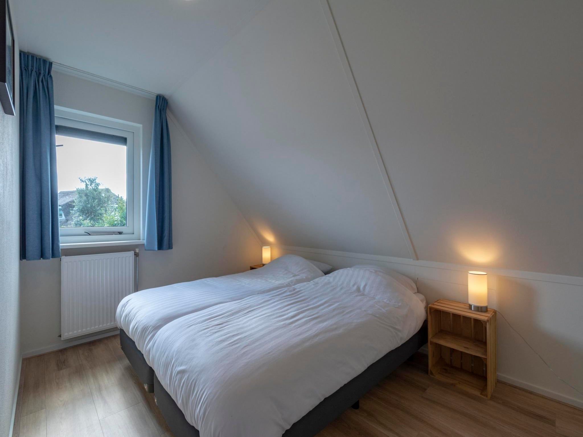 Een slaapkamer van Duynopgangh 16 in Julianadorp aan Zee