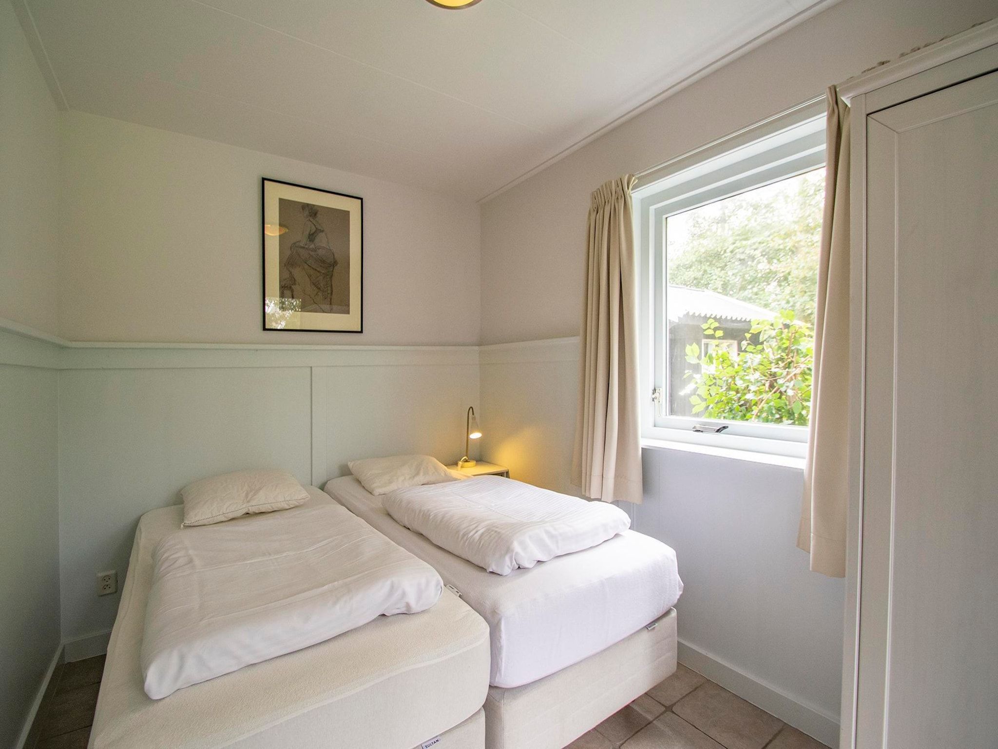 Een slaapkamer van Sandepark 151 Villa Matisse in Callantsoog