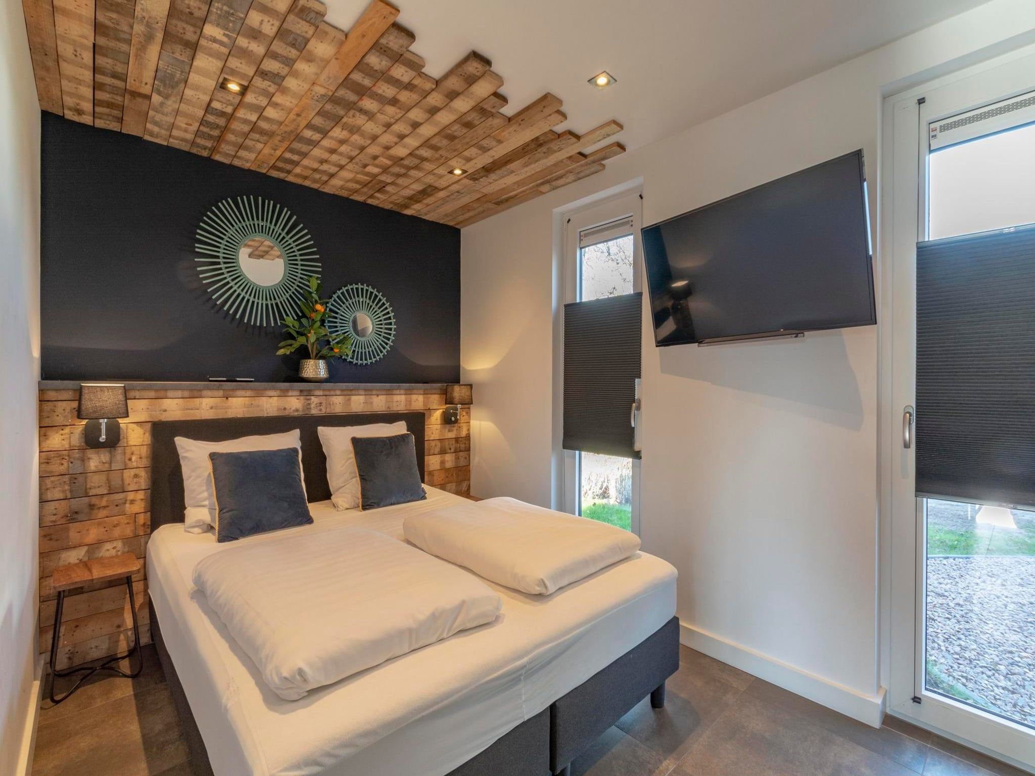 Een slaapkamer van Luxe Villa Keizerskroon - Keizerkroon 63 in Julianadorp aan Zee