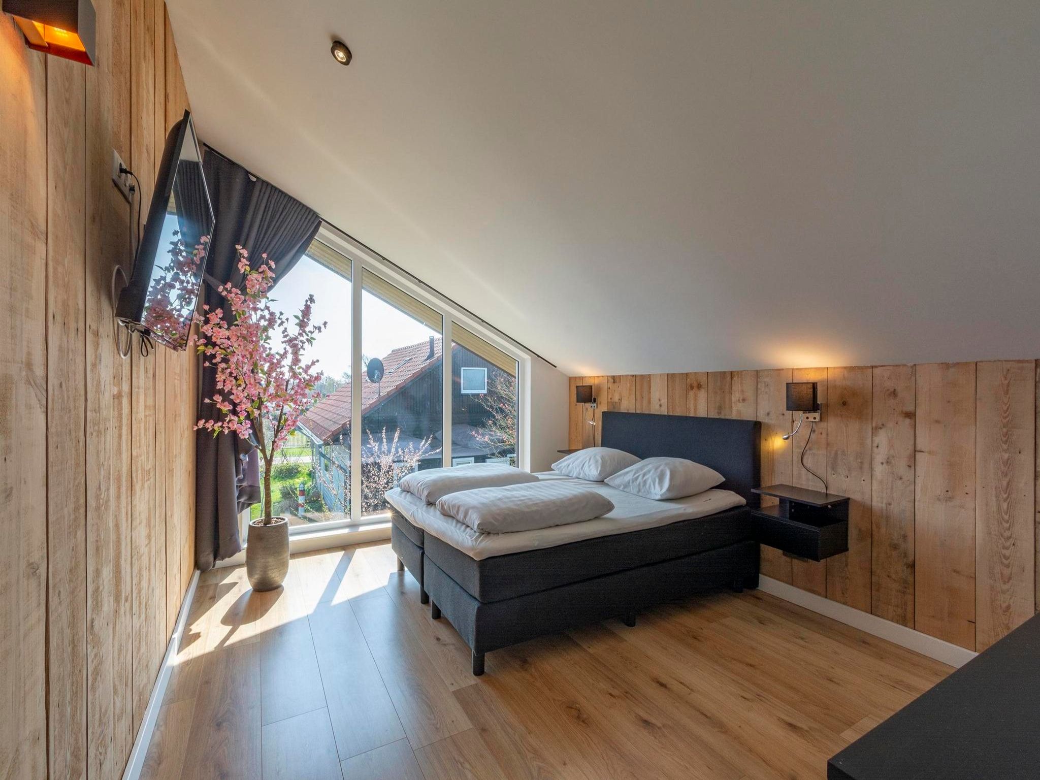 Een slaapkamer van Luxe Villa Keizerskroon - Keizerkroon 63 in Julianadorp aan Zee