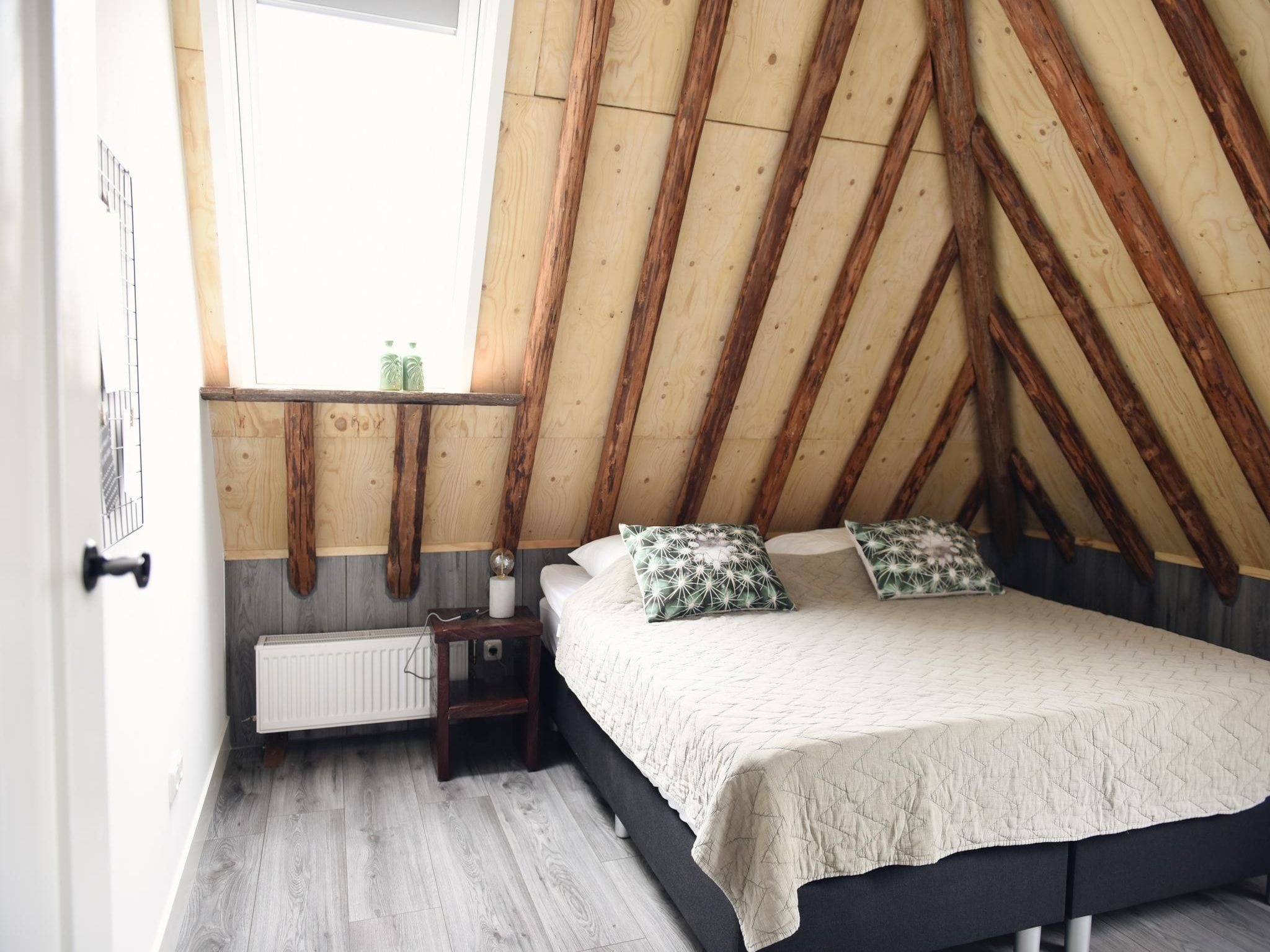 Een slaapkamer van Hoeve Landzicht in Callantsoog