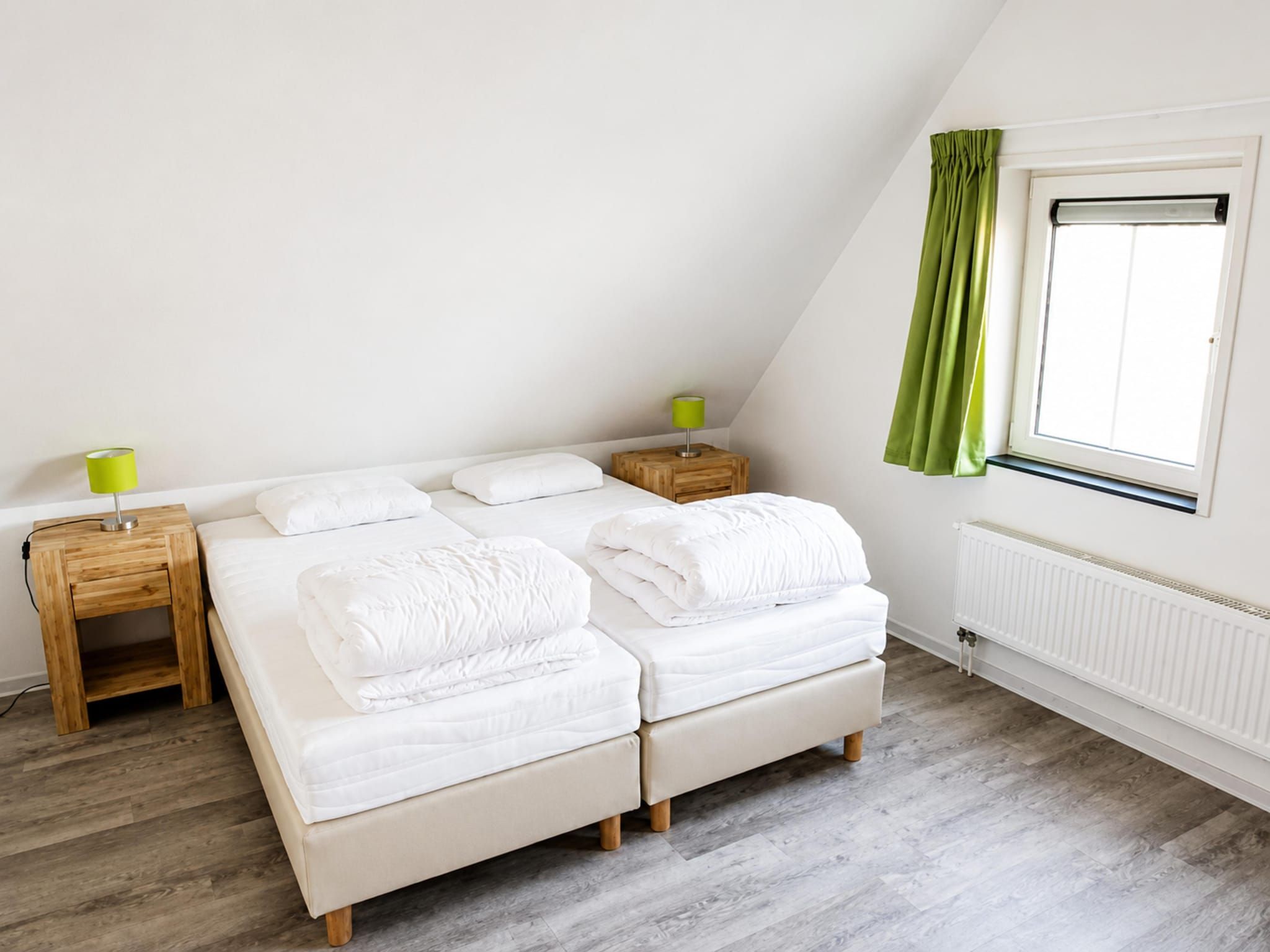 Een slaapkamer van Landgoed de Lente 12 Krokus Breskens in Breskens