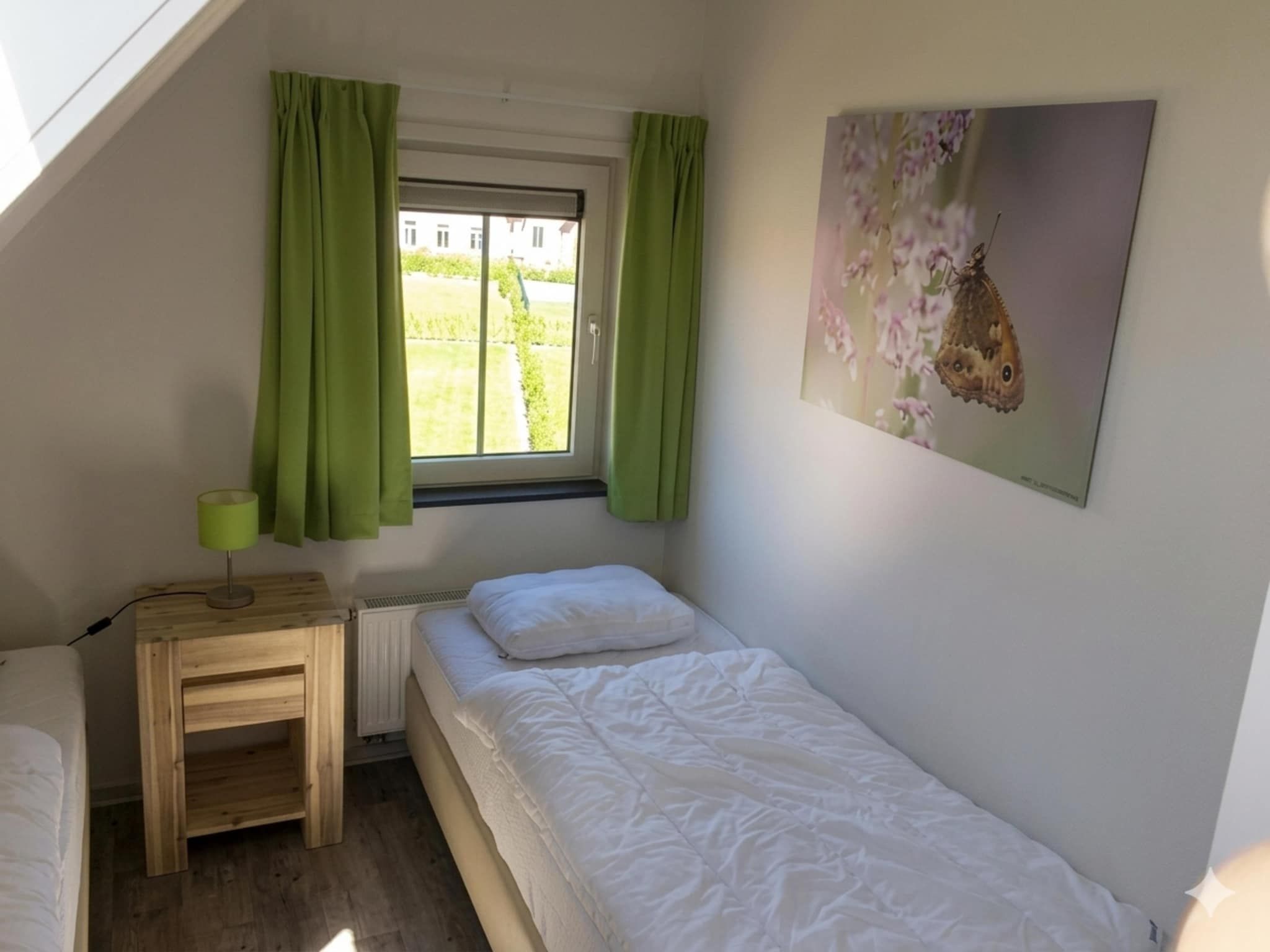 Een slaapkamer van Landgoed de Lente 12 Krokus Breskens in Breskens