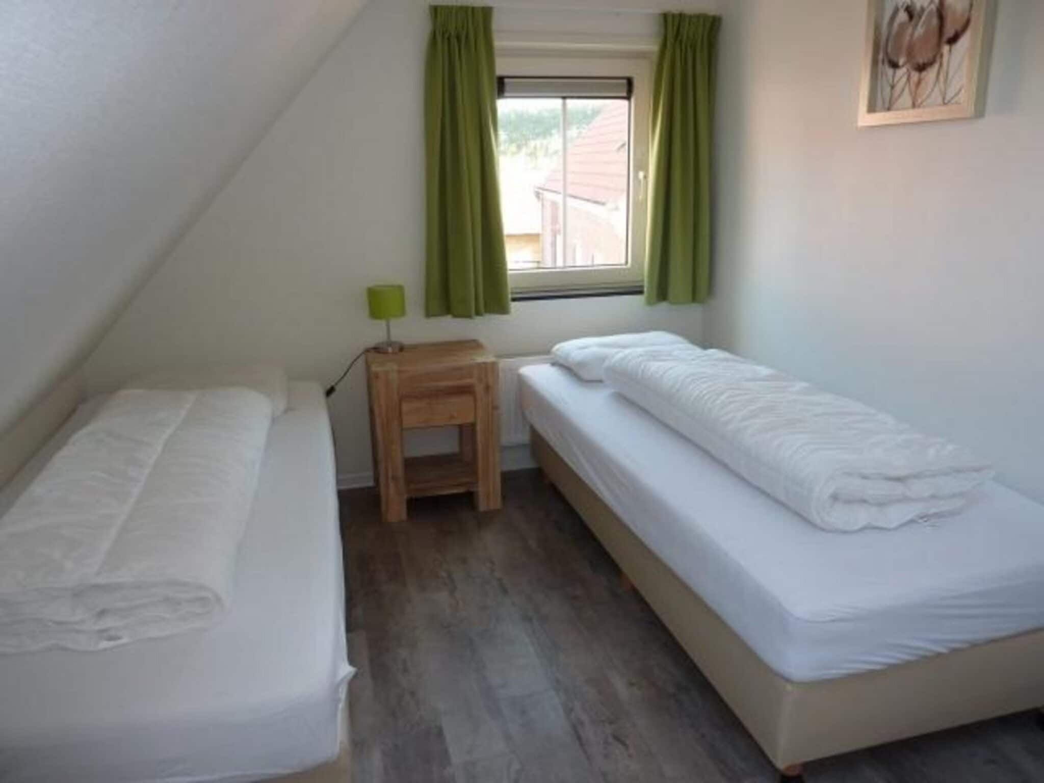 Een slaapkamer van Landgoed de Lente 36 Krokus Breskens in Breskens