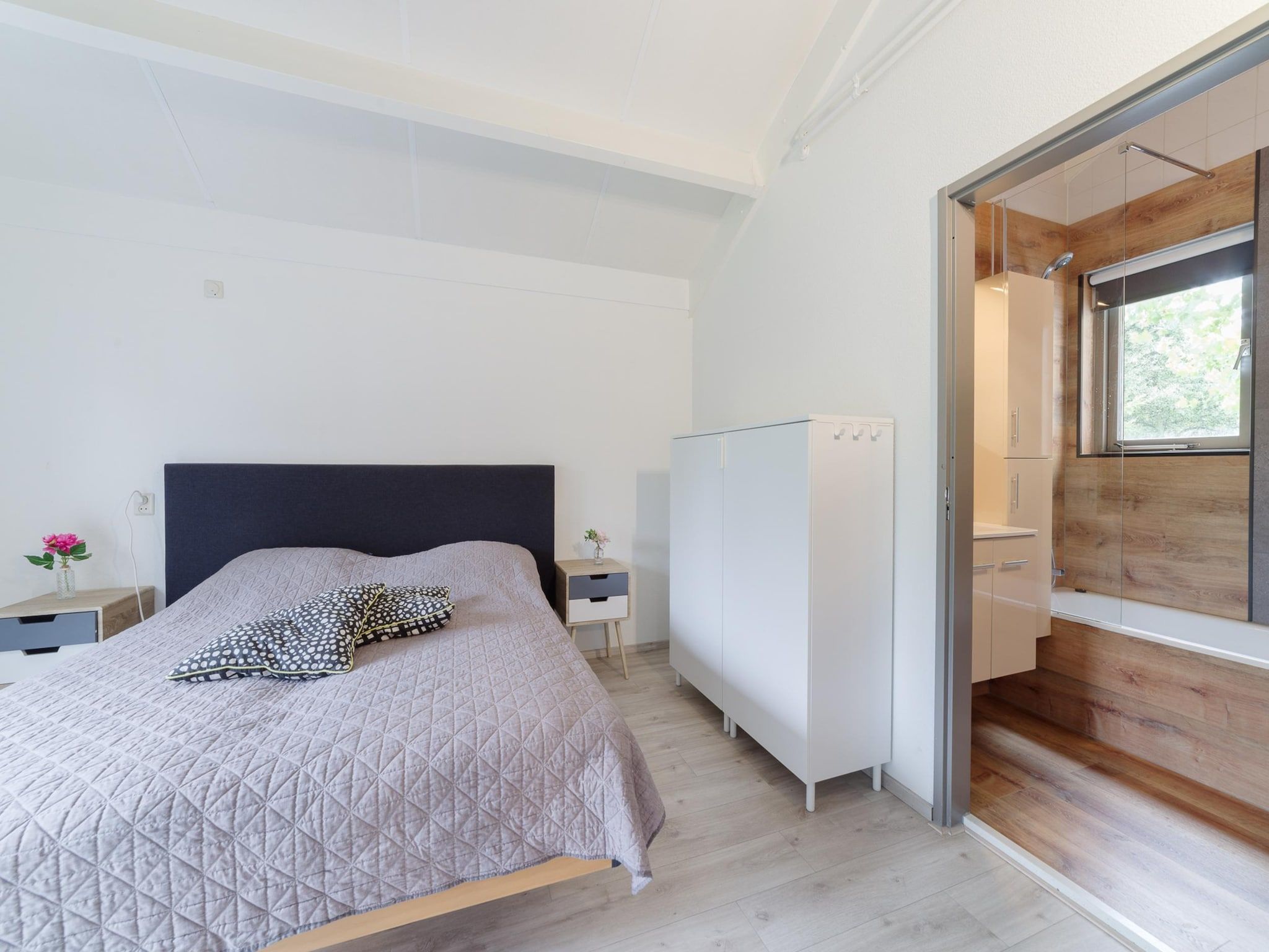 Een slaapkamer van Villapark De Oesterbaai 49 in Wemeldinge