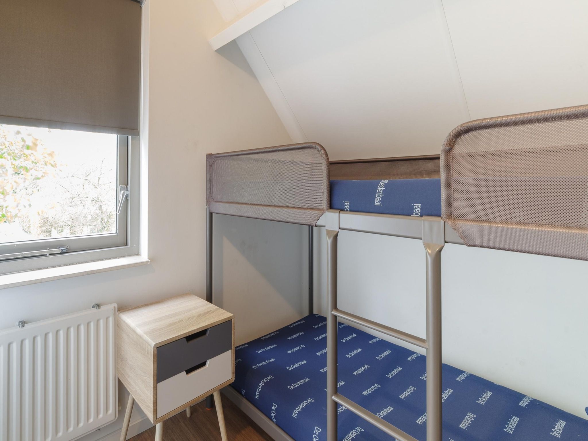 Een slaapkamer van Villapark De Oesterbaai 49 in Wemeldinge
