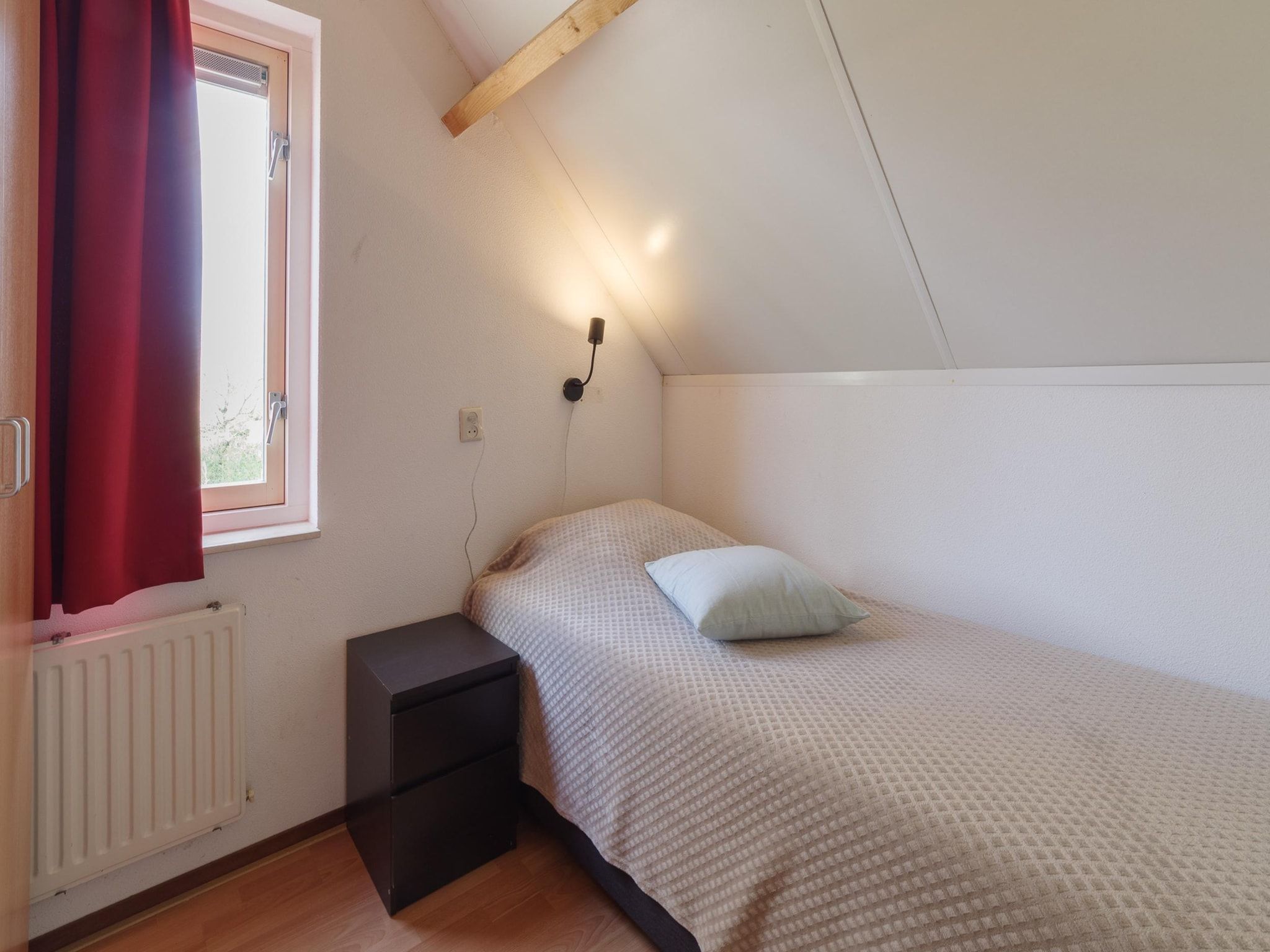 Een slaapkamer van Villapark De Oesterbaai 70 in Wemeldinge