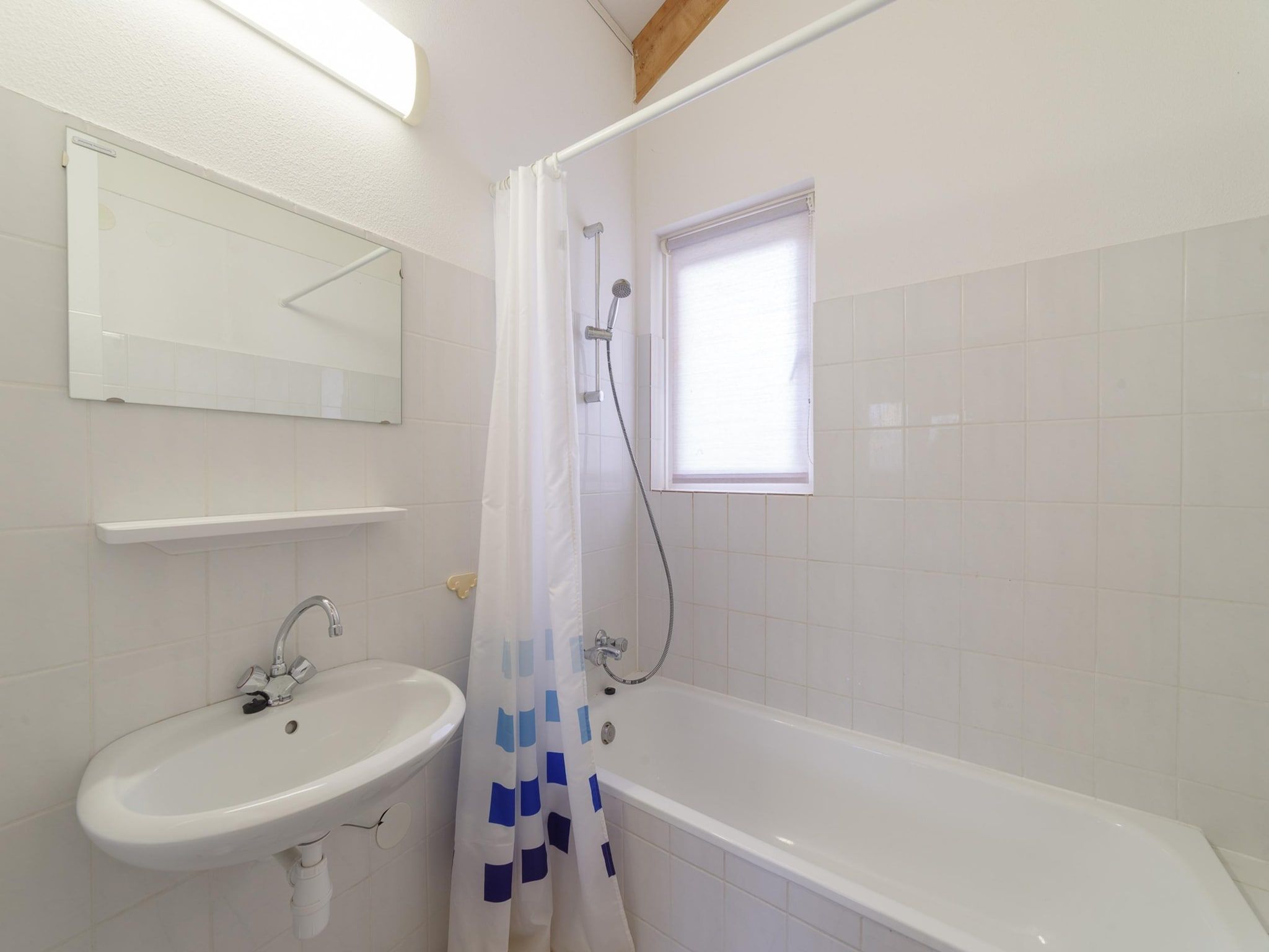 De badkamer van Villapark De Oesterbaai 91 in Wemeldinge