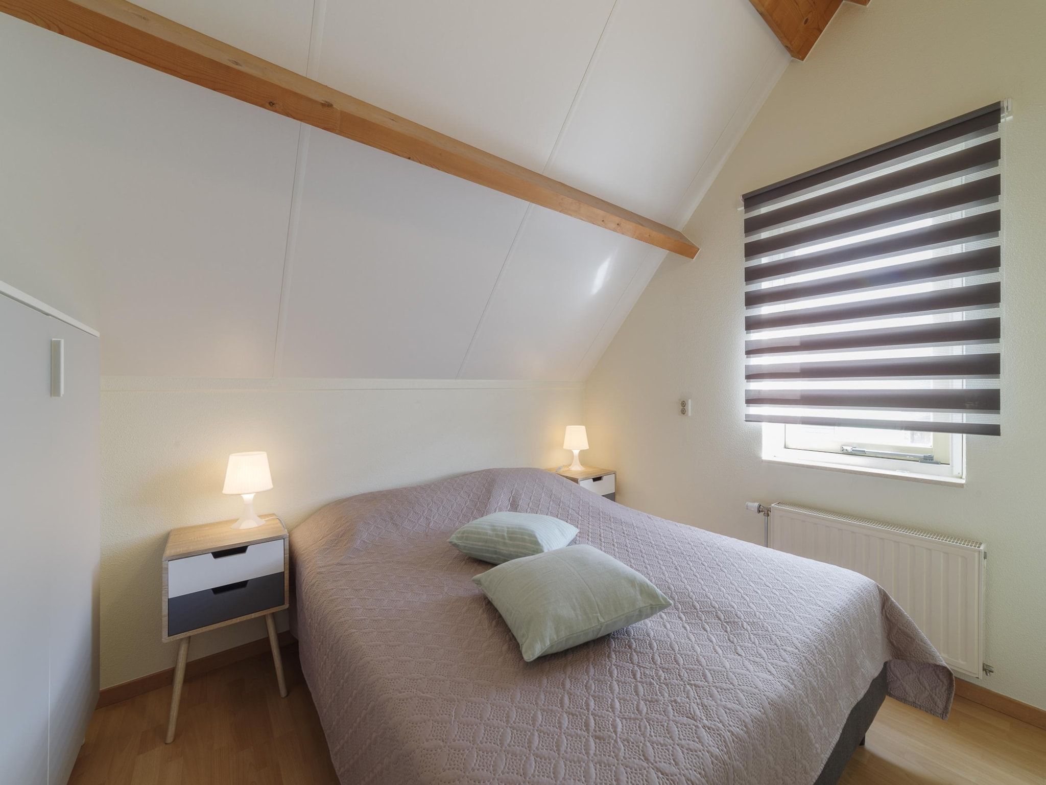 Een slaapkamer van Villapark De Oesterbaai 112 in Wemeldinge