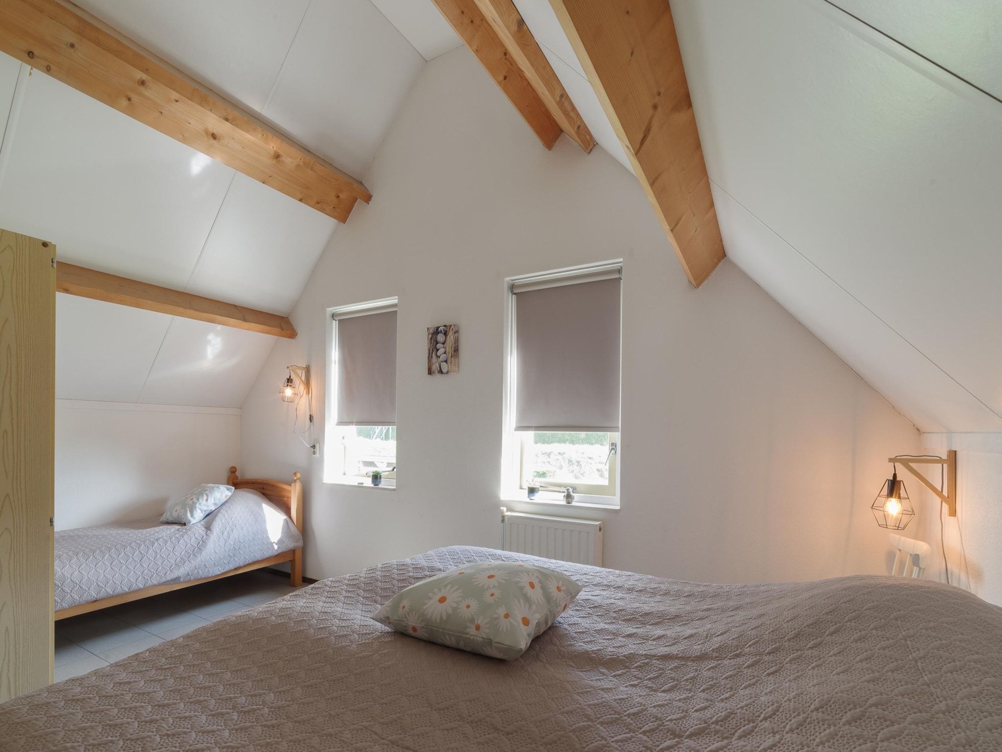 Een slaapkamer van Villapark De Oesterbaai 123 in Wemeldinge