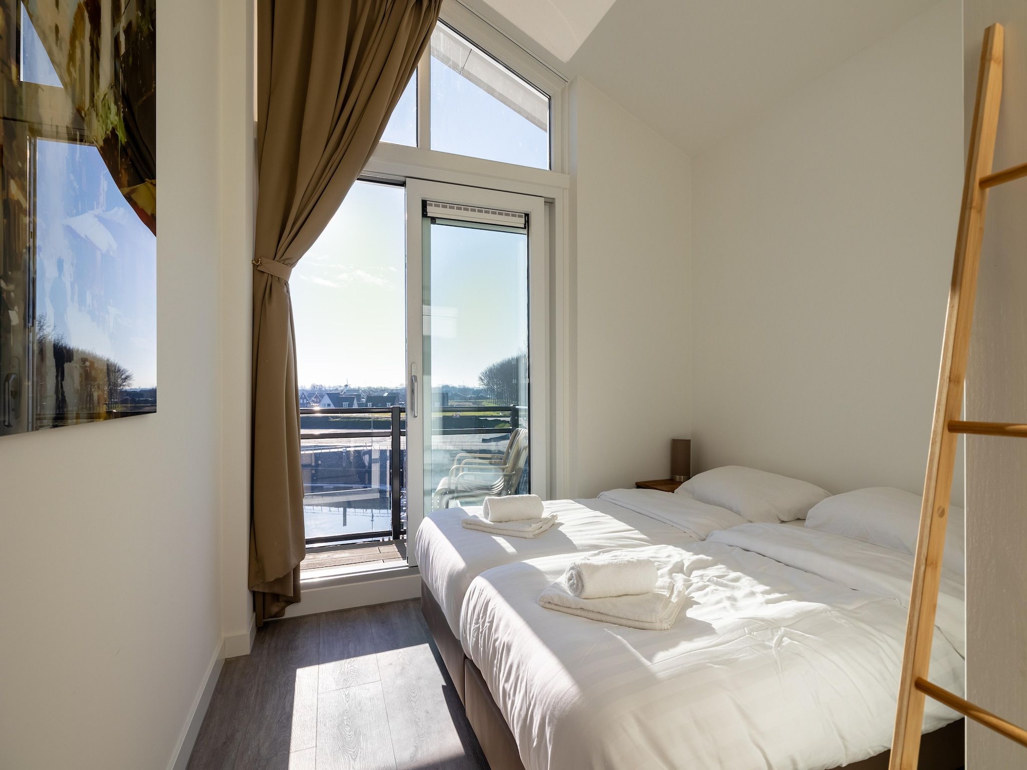 Een slaapkamer van Appartement Vista Maris 'Haus am See' - Havenweg 8-30  Sint-Annaland in Sint-Annaland