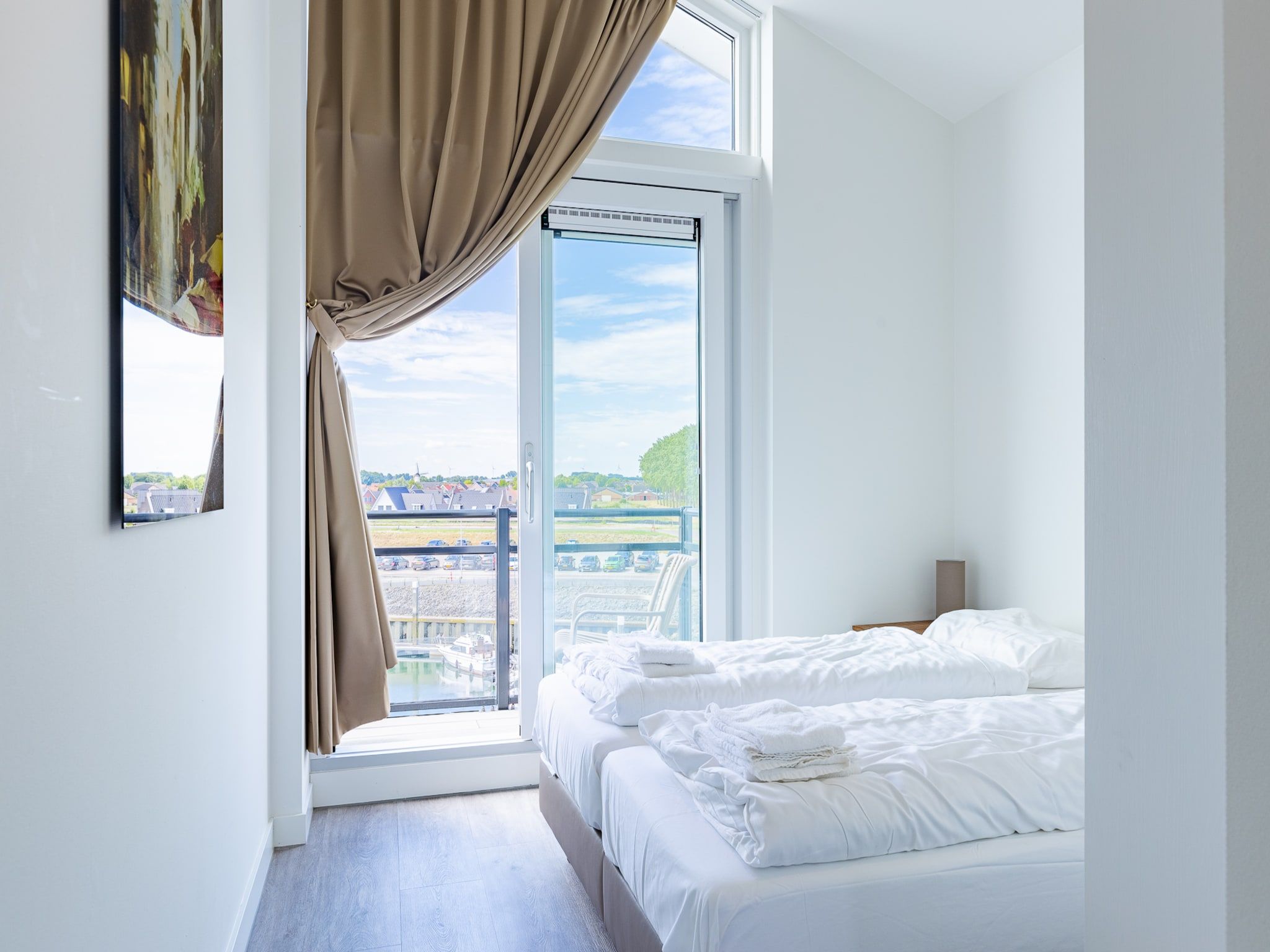 Een slaapkamer van Appartement Vista Maris 'Haus am See' - Havenweg 8-30  Sint-Annaland in Sint-Annaland