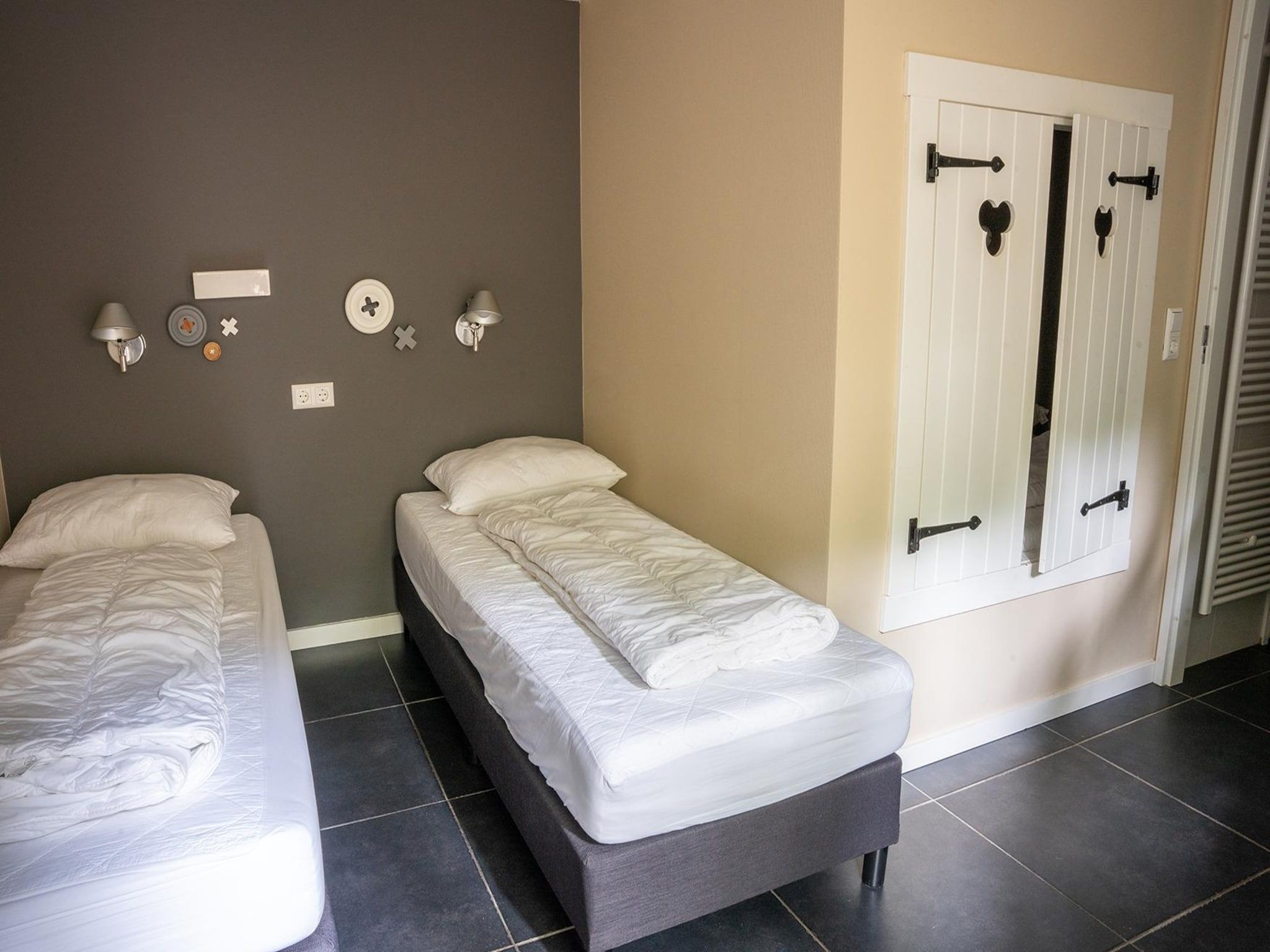 Een slaapkamer van Vlindervallei Villa 8p in Ermelo