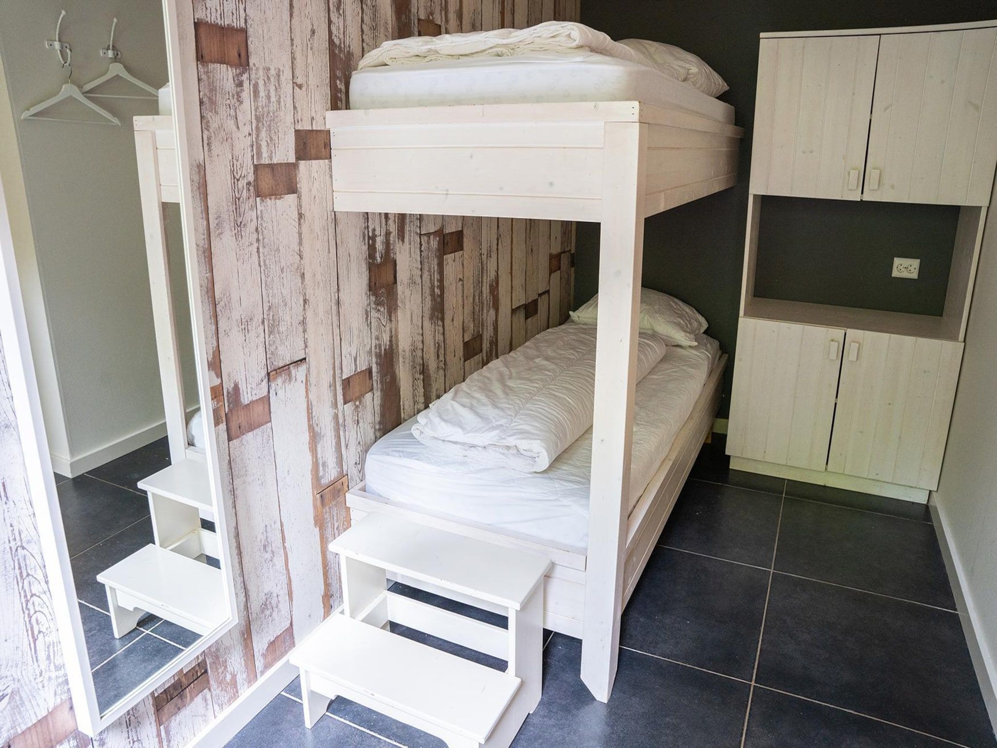 Een slaapkamer van Vlindervallei Villa 8p in Ermelo