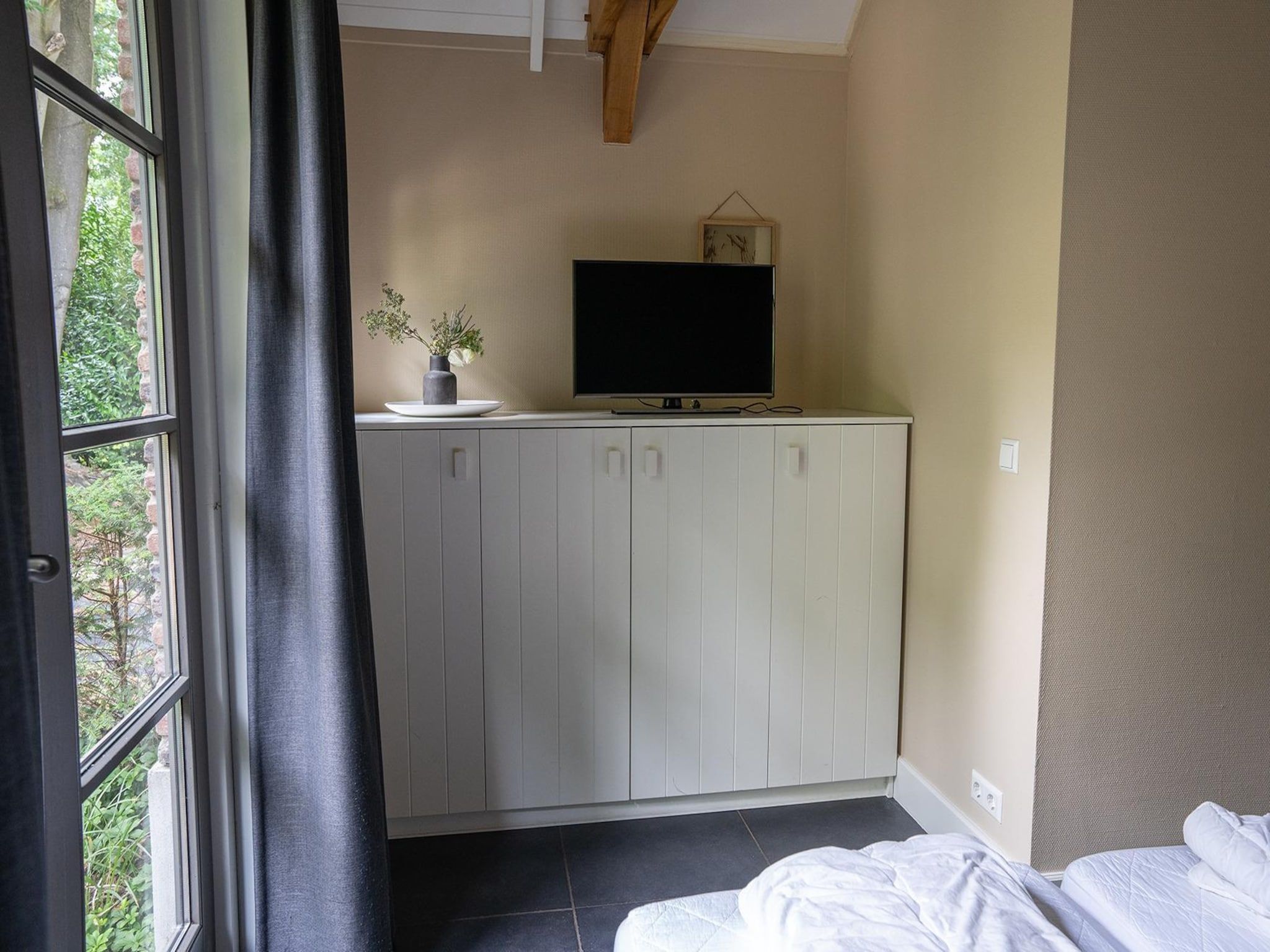 Een slaapkamer van Vlindervallei Villa 8p in Ermelo