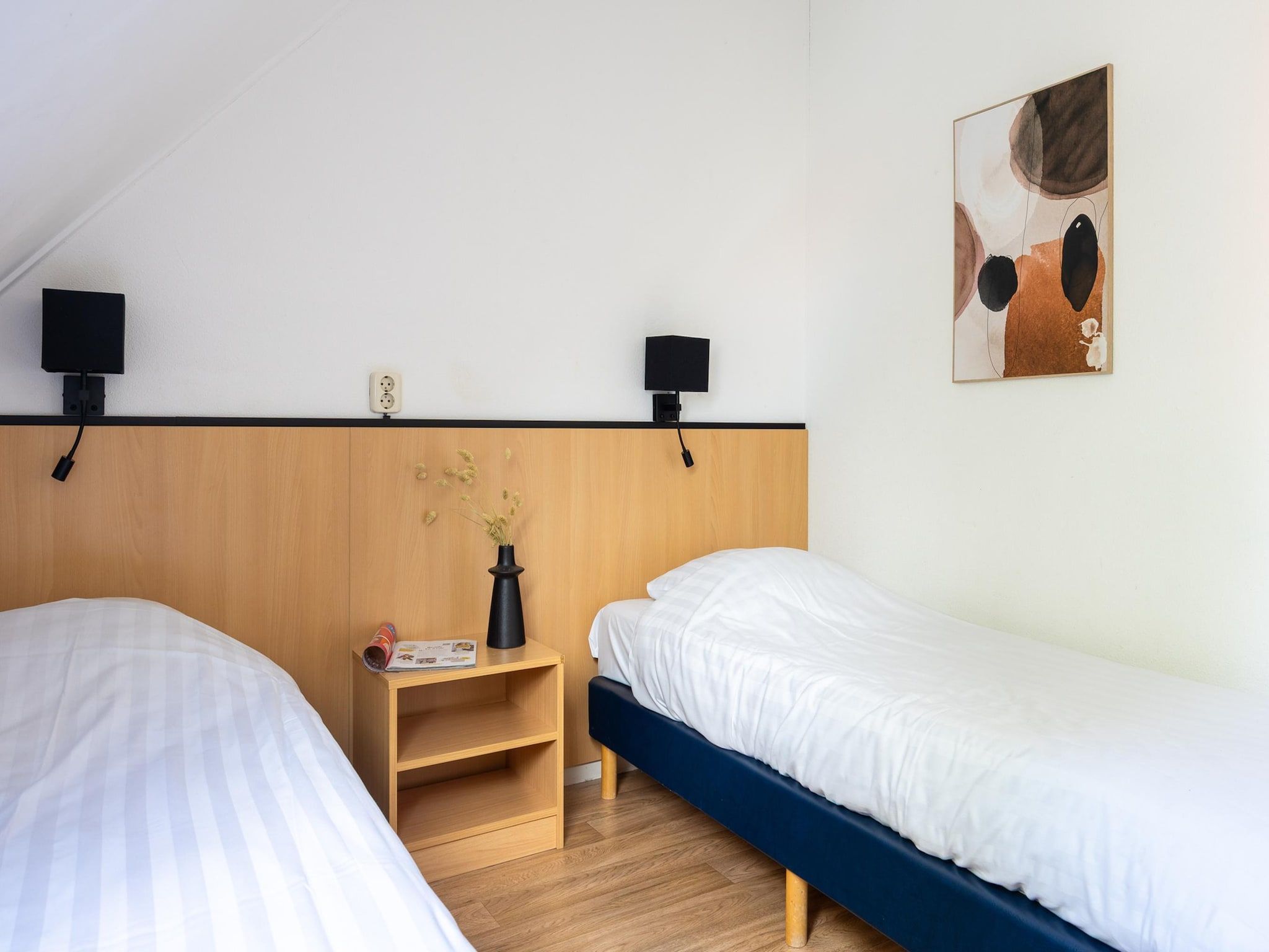 Een slaapkamer van Alkmaar 12 in Andijk