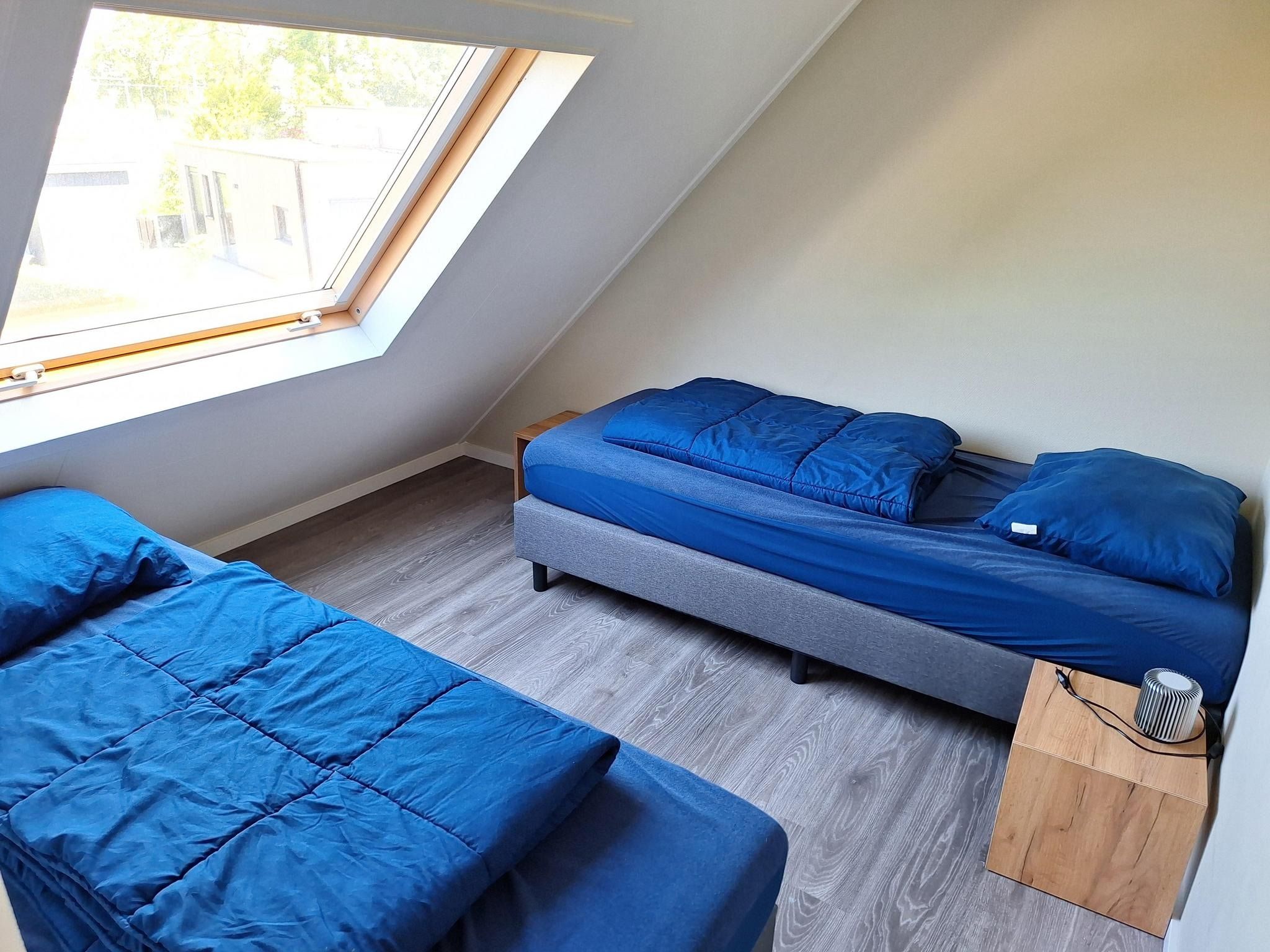 Een slaapkamer van Tulpenhof Villa  10 personen in West-Graftdijk