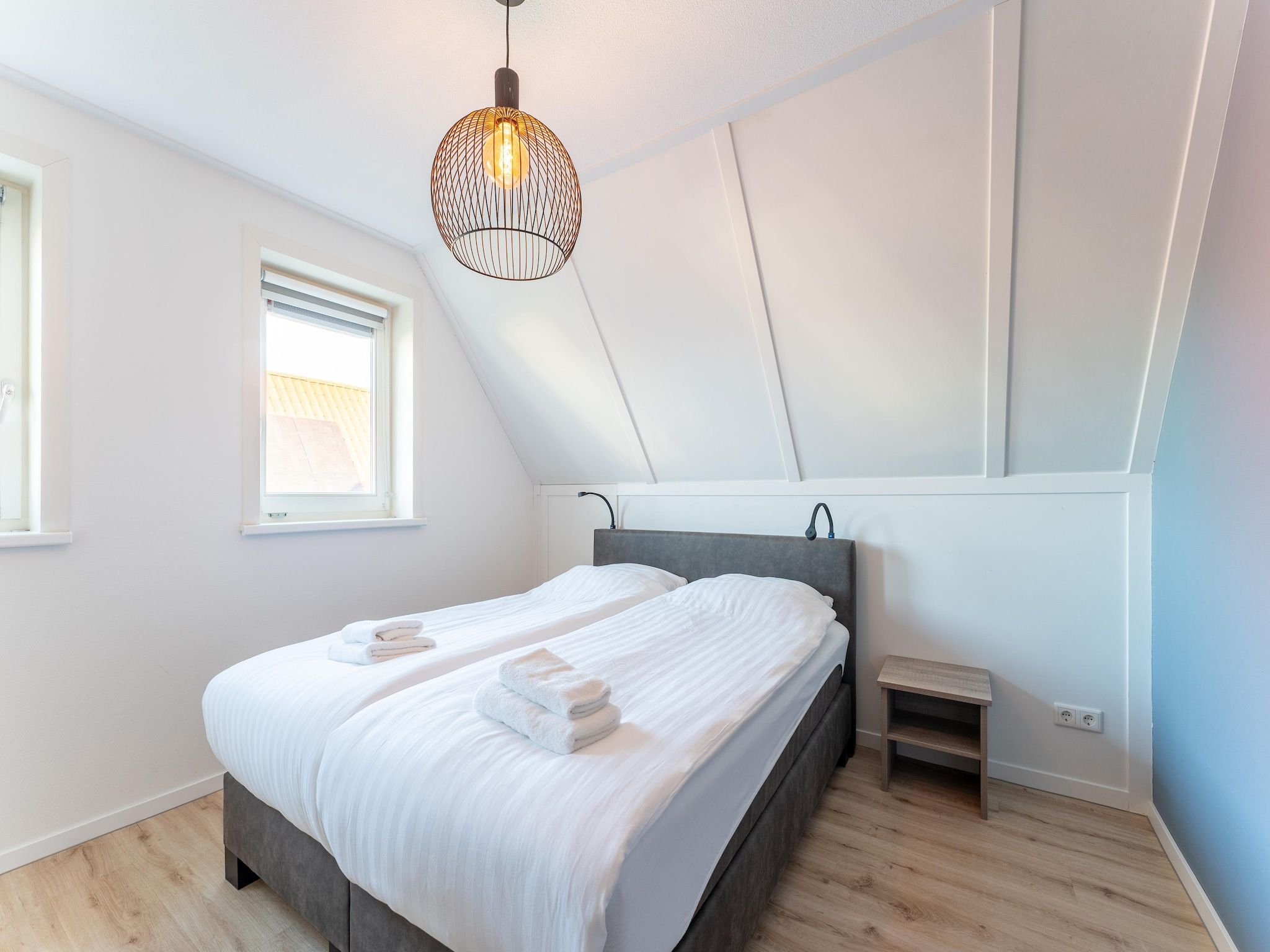 Een slaapkamer van Wulpdal 63 in Scherpenisse