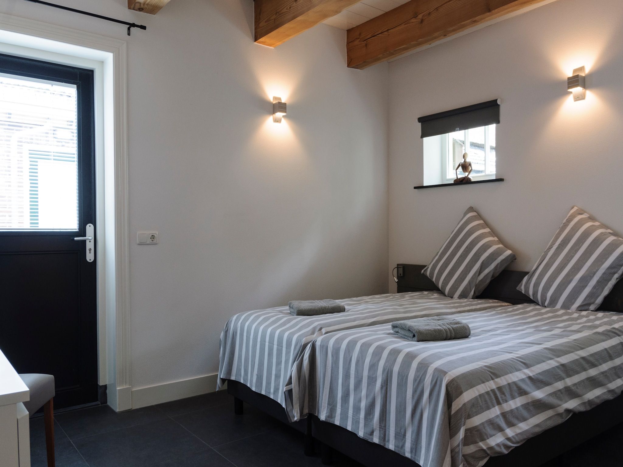 Een slaapkamer van Groepsaccomodatie - Balkenhoeve in Schagen